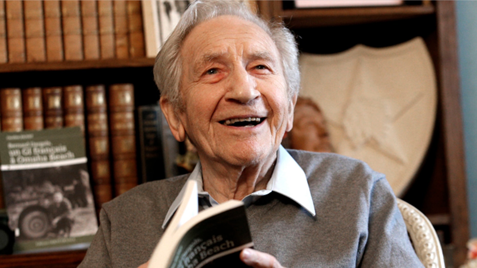 May 8, 2014: Bernard Dargols poses during an interview with the Associated Press at his home in La Garenne-Colombes, outside Paris, France. When he left Paris at age 18, the plan was to go to New York for a year and learn his fathers sewing machine trade. Six years later, Bernard Dargols found himself crossing the Channel in a U.S. Army uniform, sloshing ashore on Omaha Beach to a homeland that had persecuted his Jewish family.