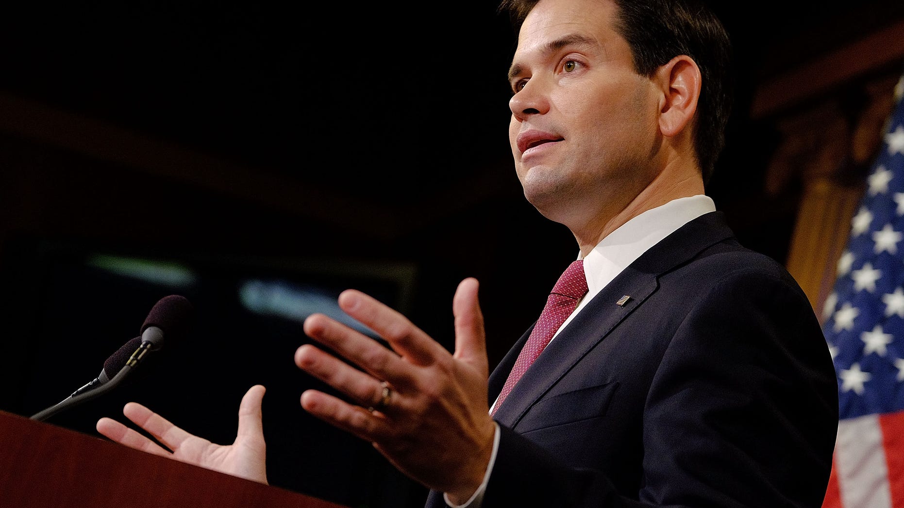 WASHINGTON, DC - DECEMBER 17: Sen. Marco Rubio (R-FL) reacts to U.S. President Barack Obama's announcement about revising policies on U.S.-Cuba relations on December 17, 2014 in Washington, DC. Rubio called the President a bad negotiator and criticized what he claimed was a deal with no democratic advances for Cuba. (Photo by T.J. Kirkpatrick/Getty Images)