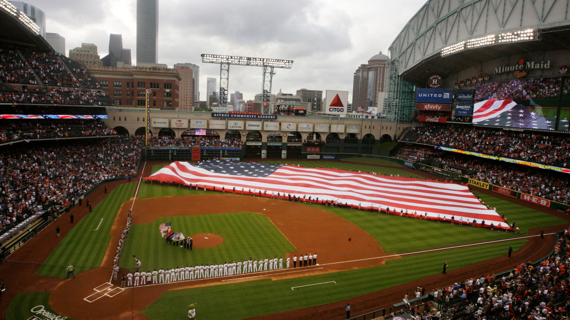 A U.S. flag is placed in the outfield for the national anthem before a baseball game between the Houston Astros and the New York Yankees, April 1, 2014, in Houston.