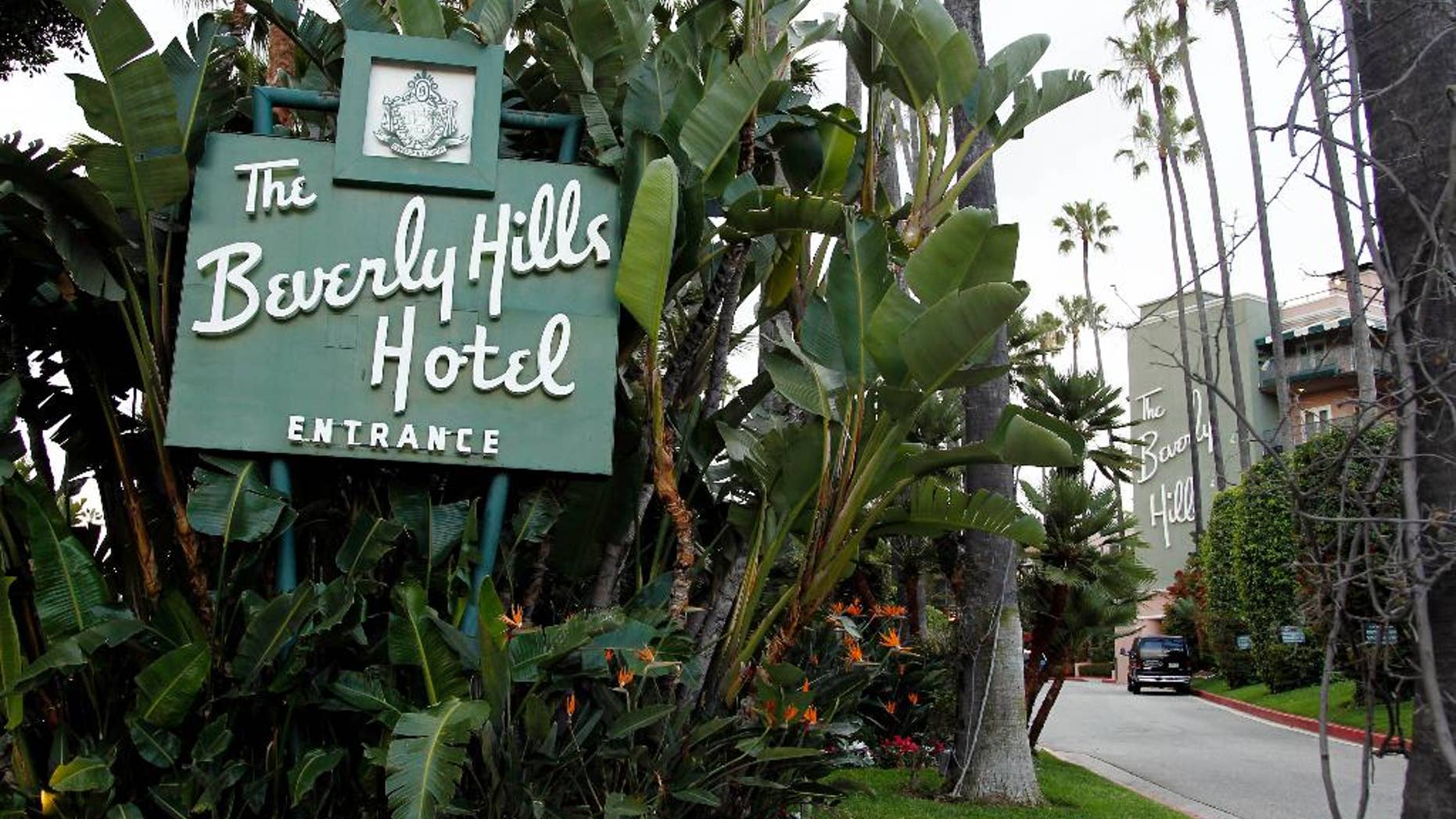 FILE - In this April 25, 2012 file photo, the entrance to the Beverly Hills Hotel is seen in Beverly Hills, Calif. Hollywood is responding to harsh new laws in Brunei by boycotting the Beverly Hills Hotel. The Motion Picture & Television Fund joined a growing list of organizations and individuals Monday, May 5, 2014, refusing to do business with hotels owned by the Sultan or government of Brunei to protest the country’s new penal code that calls for punishing adultery, abortions and same-sex relationships with flogging and stoning. (AP Photo/Matt Sayles, File)