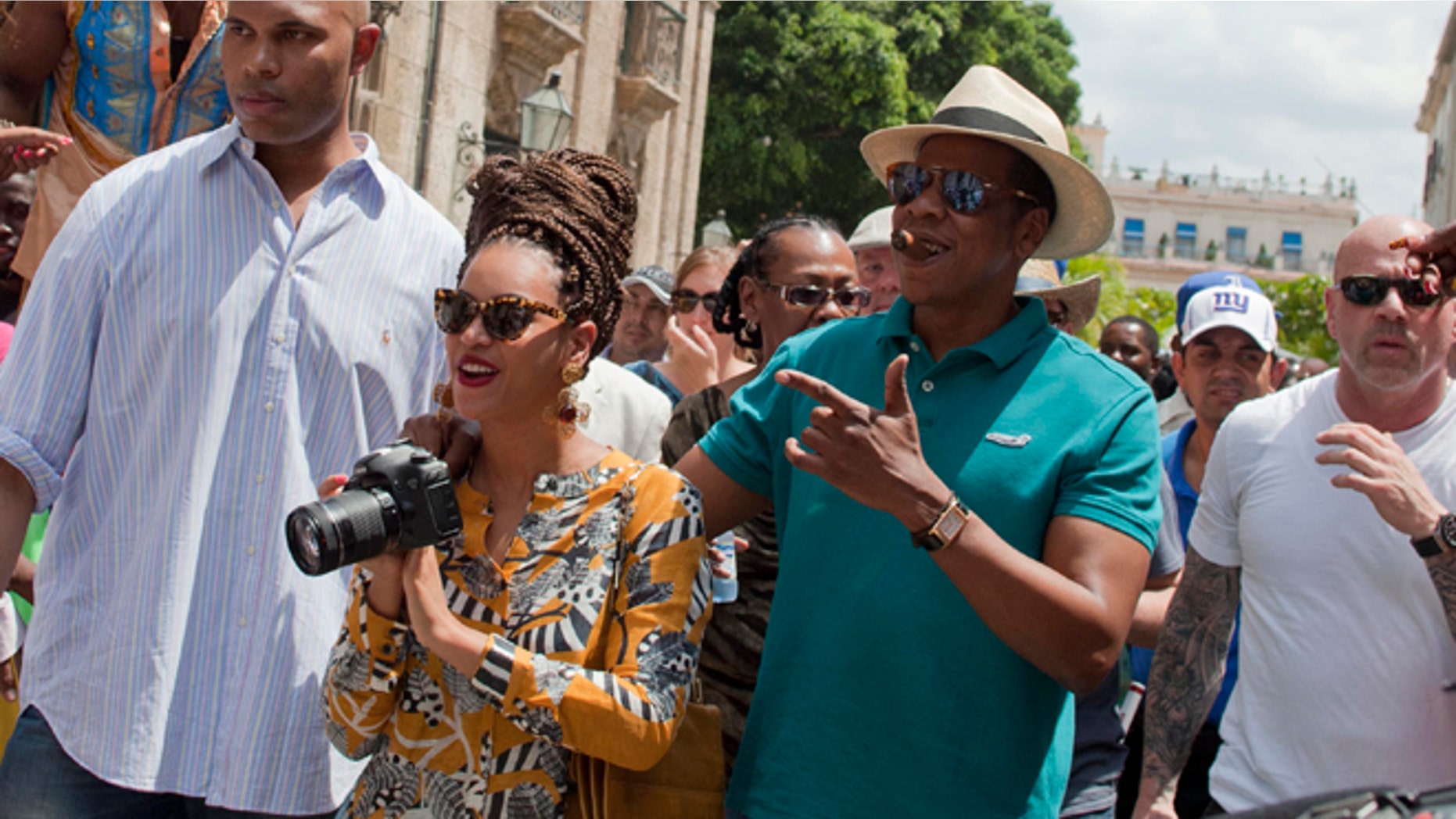 April 4, 2013: Singer Beyonce and her husband, rapper Jay-Z, are surrounded by body guards as they tour Old Havana, Cuba.