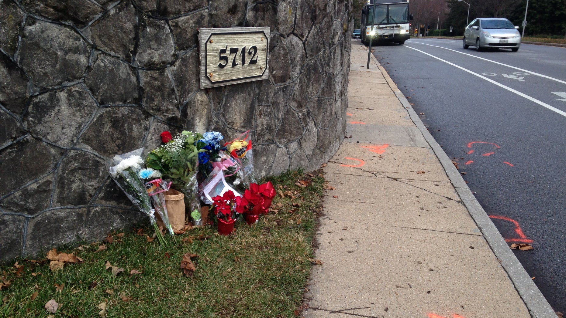 Dec. 29, 2014 - Flowers and messages at the scene of a fatal collision between a car and bicyclist along a Baltimore residential street. The Episcopal Church of Maryland says one of its bishops was driving the car Saturday when it struck cyclist Tom Palermo, fatally injuring him. Baltimore Police are investigating.