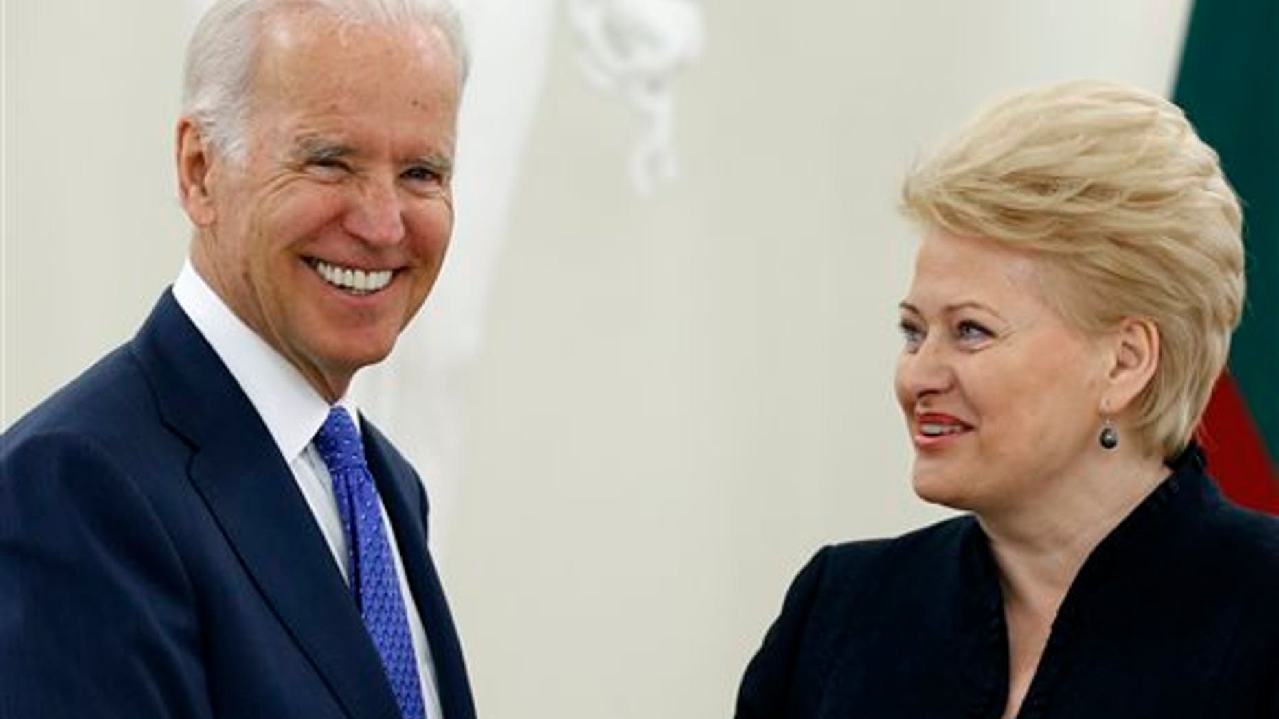 Vice President Joe Biden, left, and Lithuania's President Dalia Grybauskaite speak prior to their meeting at the Presidential Palace in Vilnius, Lithuania, Wednesday, March 19, 2014. Biden arrived in Vilnius for consultations with Grybauskaite and Latvia's President Andris Berzins, a few hours after Russian President Vladimir Putin approved a draft bill for the annexation of Crimea, one of a flurry of steps to formally take over the Black Sea peninsula. (AP Photo/Mindaugas Kulbis)
