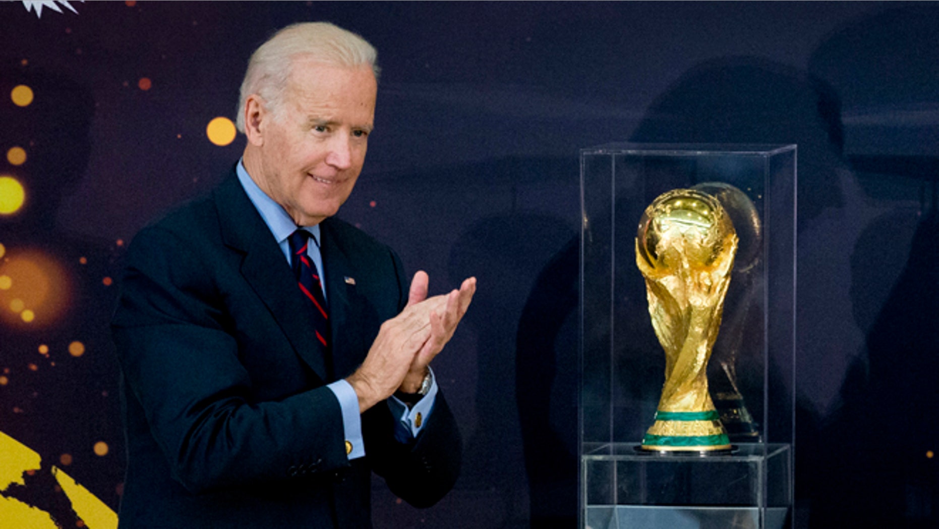 Vice President Joe Biden and Secretary of State John Kerry applaud after unveiling the FIFA World Cup trophy, the actual trophy that will be awarded to the winner of this years World Cup soccer tournament in Brazil, Monday, April 14, 2014, during a ceremony at the State Department in Washington. (AP Photo/Manuel Balce Ceneta)