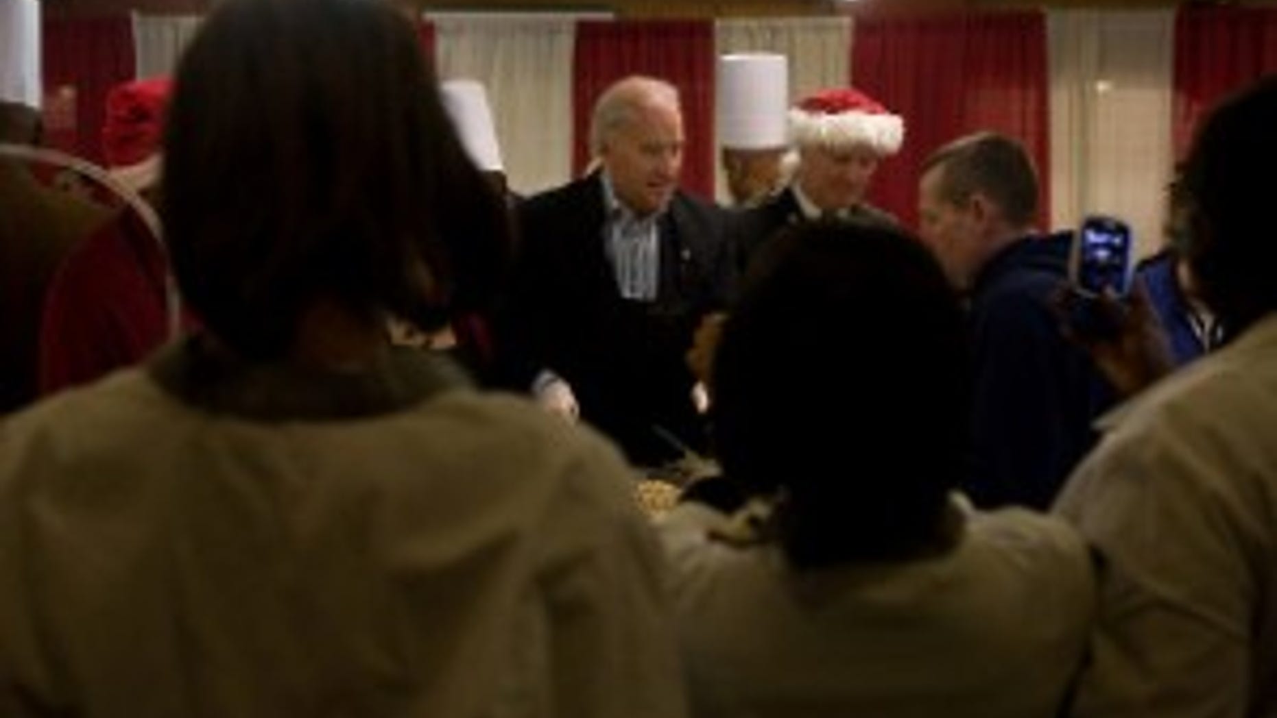 Vice President Joe Biden serves lunch to patients and staff in the dining facility at Walter Reed Army Medical Center on Christmas Day, December 25, 2009. The Vice President and Dr. Biden served Christmas lunch and met with families and wounded soldiers during their visit to Walter Reed. (Official White House Photo by David Lienemann)