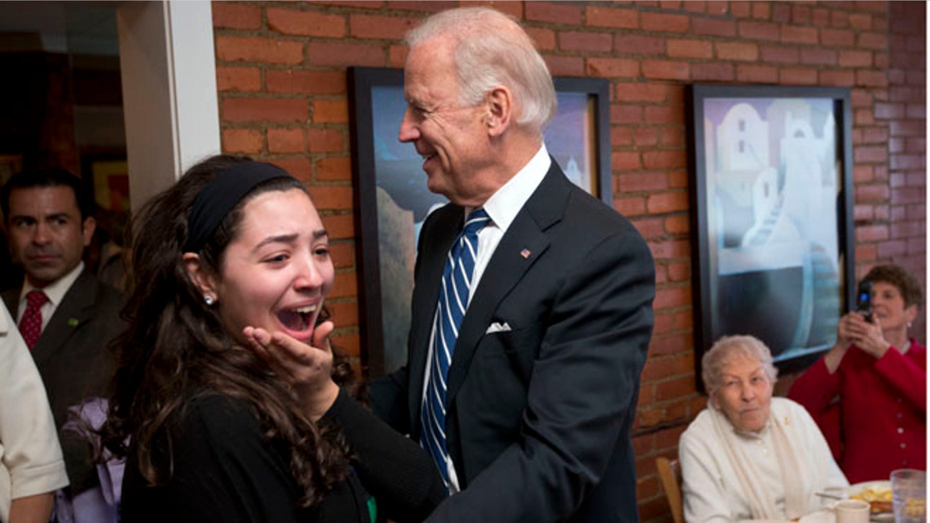 Sunday, Nov. 4, 2012: Amira Nasrallah, reacts to meeting Vice President Joe Biden during his visit to My Friends Cafe , in Cleveland, Ohio.