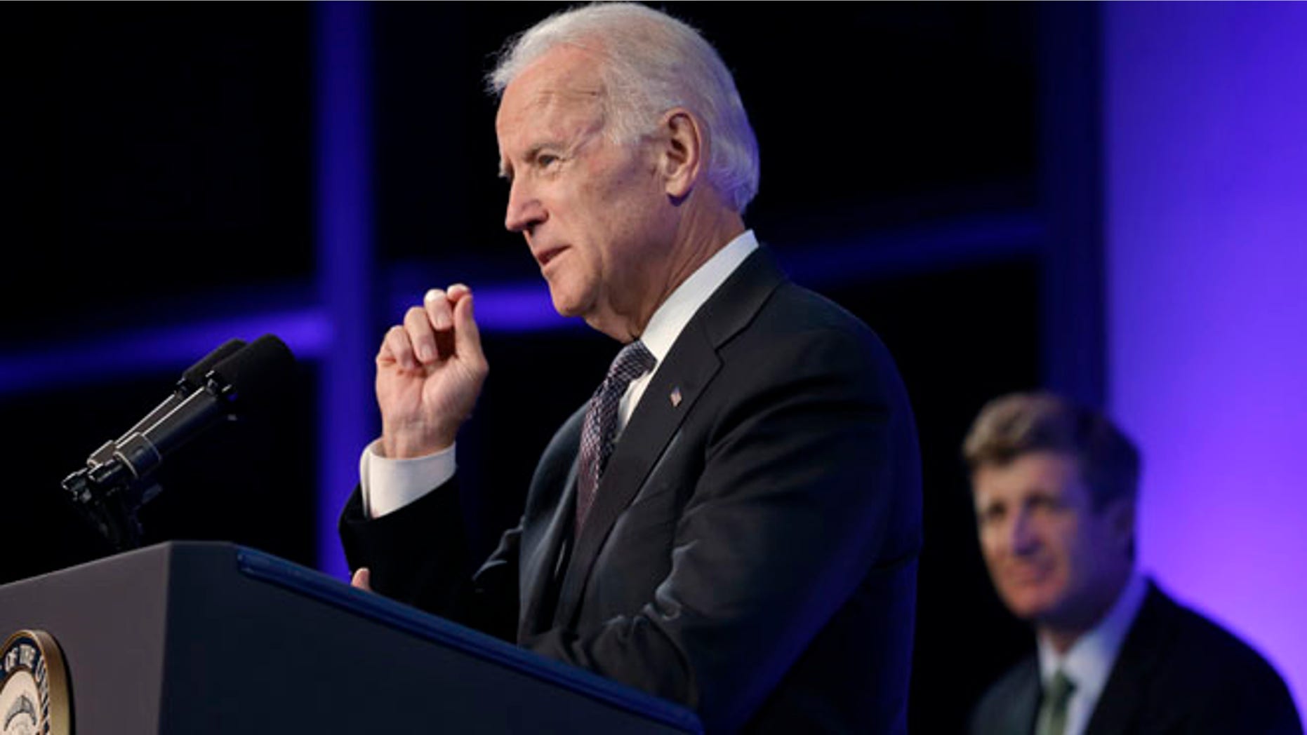 Oct. 23, 2013: Vice President Joe Biden, left, addresses an audience during a forum on mental health policies that marks the 50th anniversary of President John F. Kennedy's signing of the Community Mental Health Act at the JFK Library and Museum in Boston.