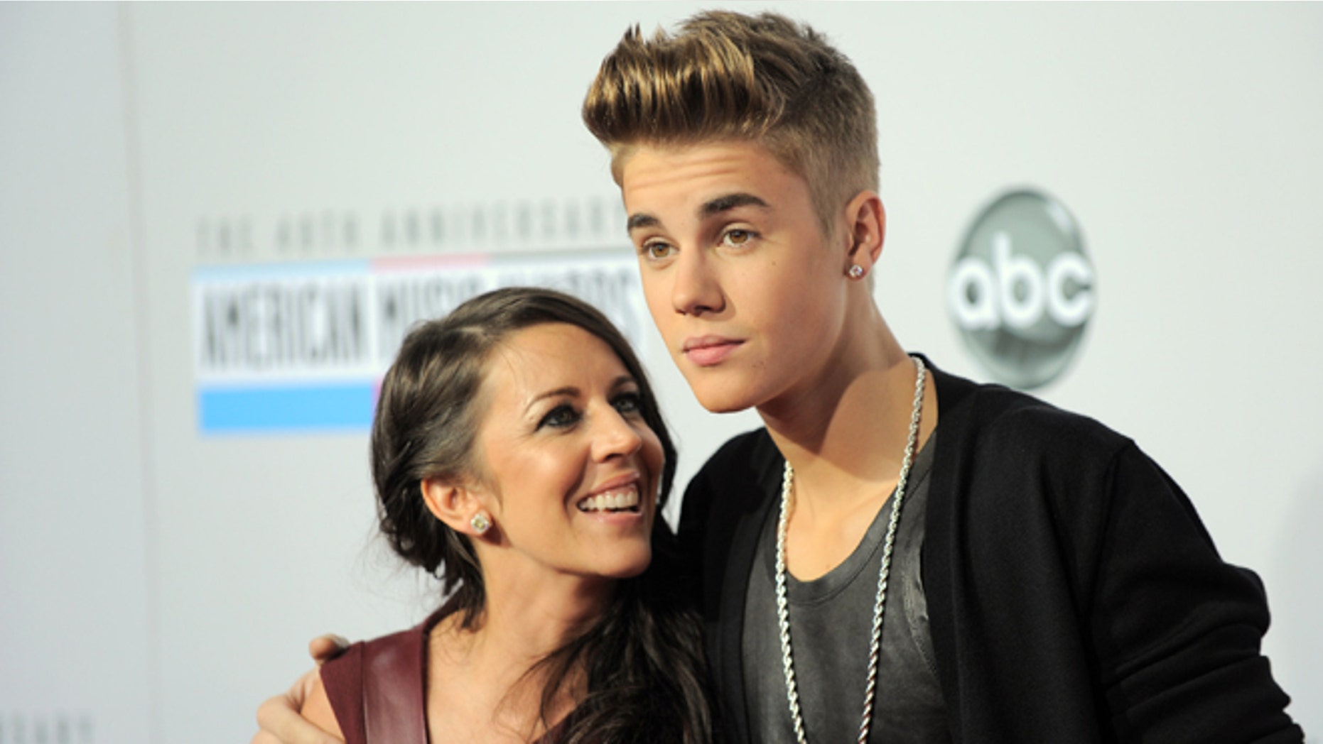 Nov. 18, 2012: In this file photo, Justin Bieber, right, and Pattie Mallette arrive at the 40th Anniversary American Music Awards, in Los Angeles.