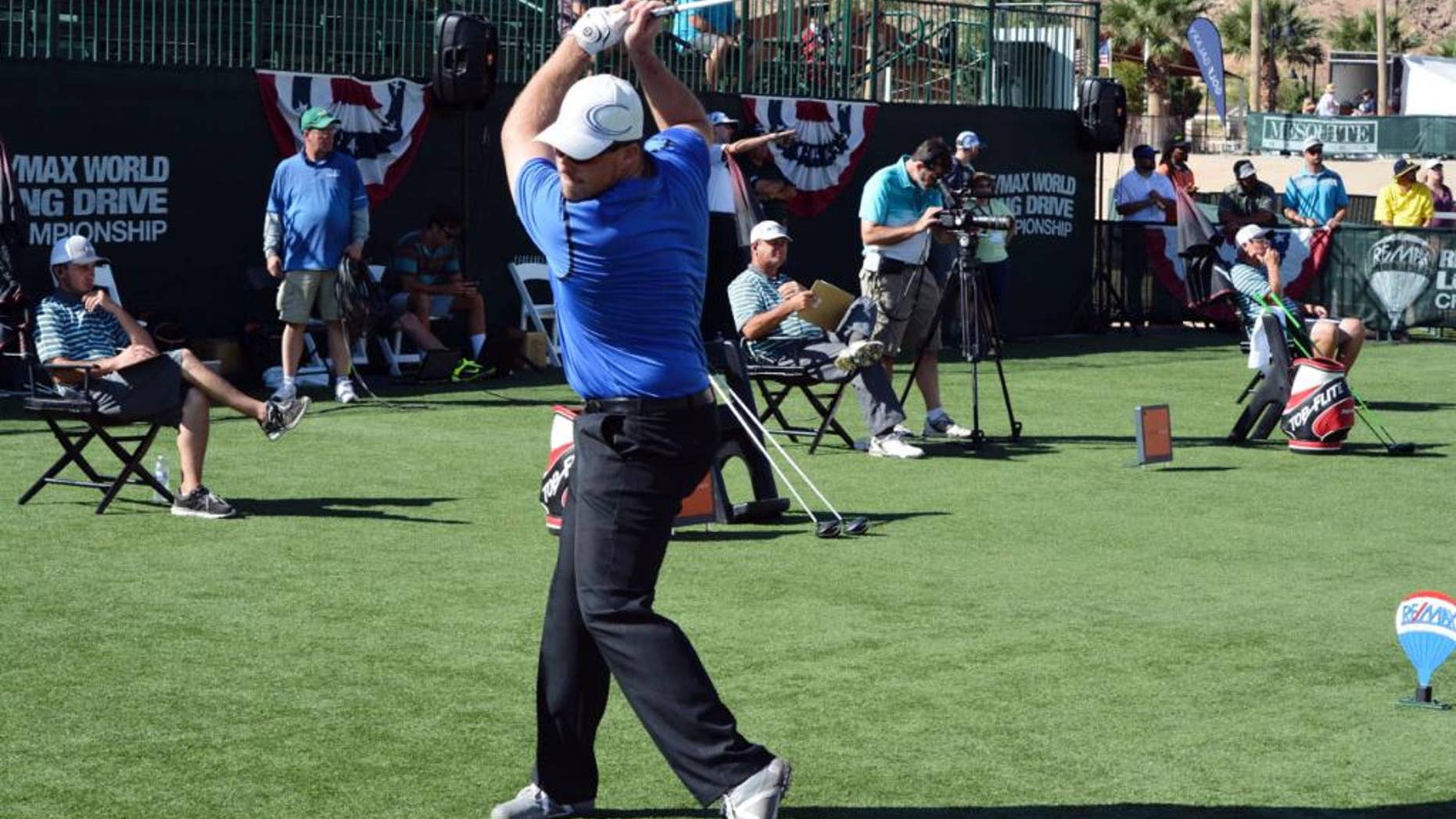 In this Sept. 27, 2014 photo provided by the Long Drivers of America, Connor Powers qualifies to become one of the Las Vegas 8 in Mesquite, Nev. Powers has a bit of Happy Gilmore in him as he winds up to attack a golf ball with his driver, though he doesn't shoot the kind of low scores Adam Sandler's character did in the movie. On Tuesday, Nov. 4, he could earn a cool $250,000 if he can be the biggest of the big hitters in the winner-take-all RE/MAX World Long Drive Championship. (AP Photo/Long Drivers of America)