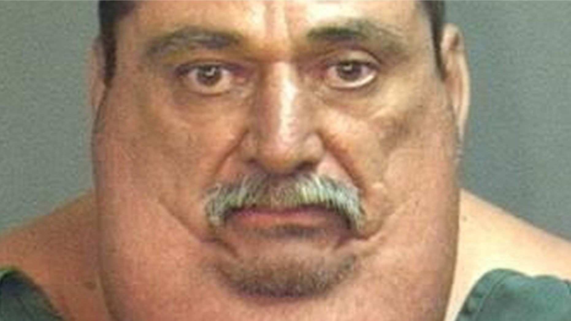 This photo provided by the Santa Ana Police Dept. shows 55-year-old Victor Joseph Espinoza.
