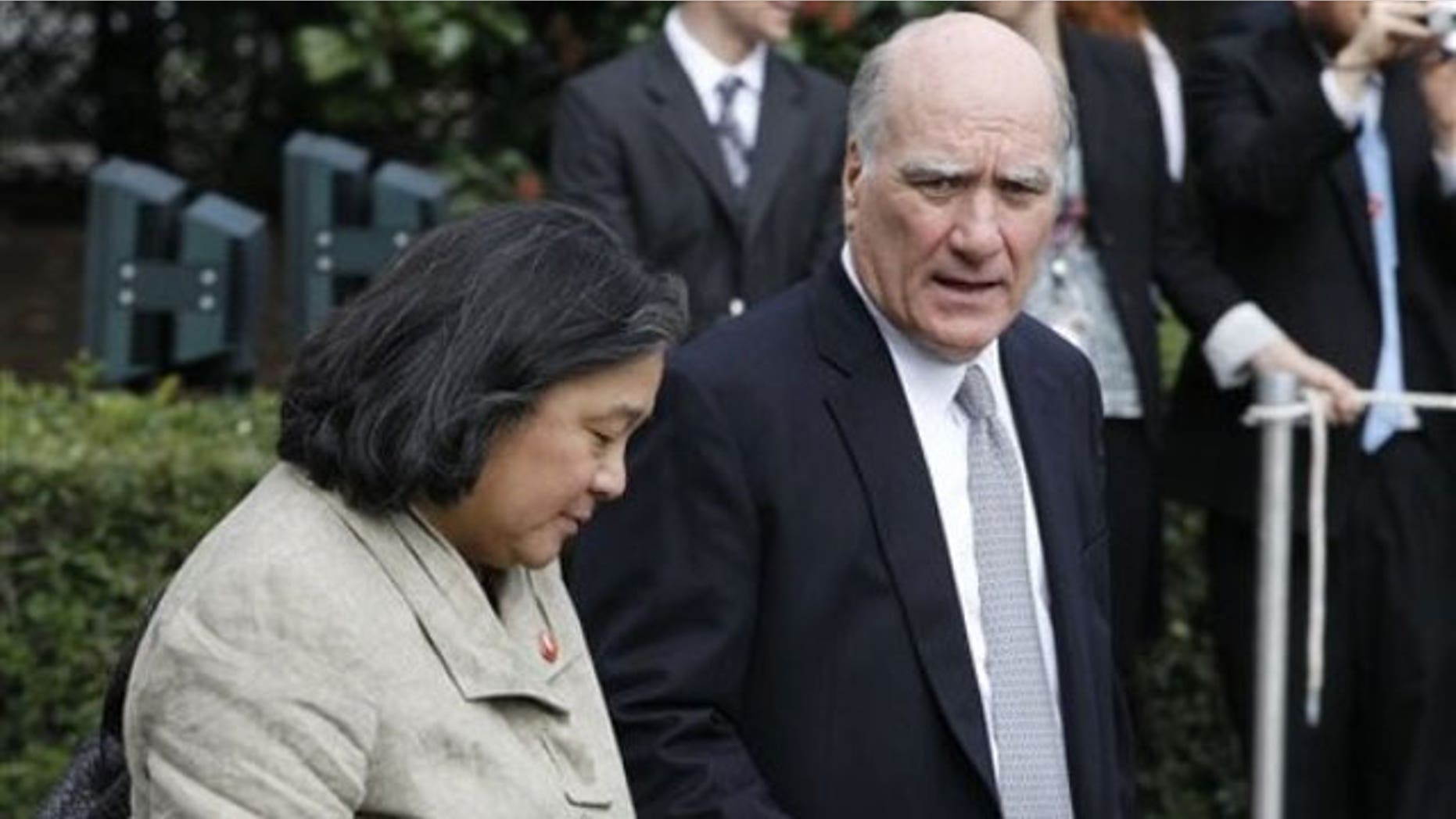 September 19, 2011: White House Chief of Staff William Daley, right, walks with Tina Tchen, Chief of Staff to Michelle Obama, on the South Lawn of the White House in Washington as they accompany President Barack Obama and first lady Michelle Obama to New York.