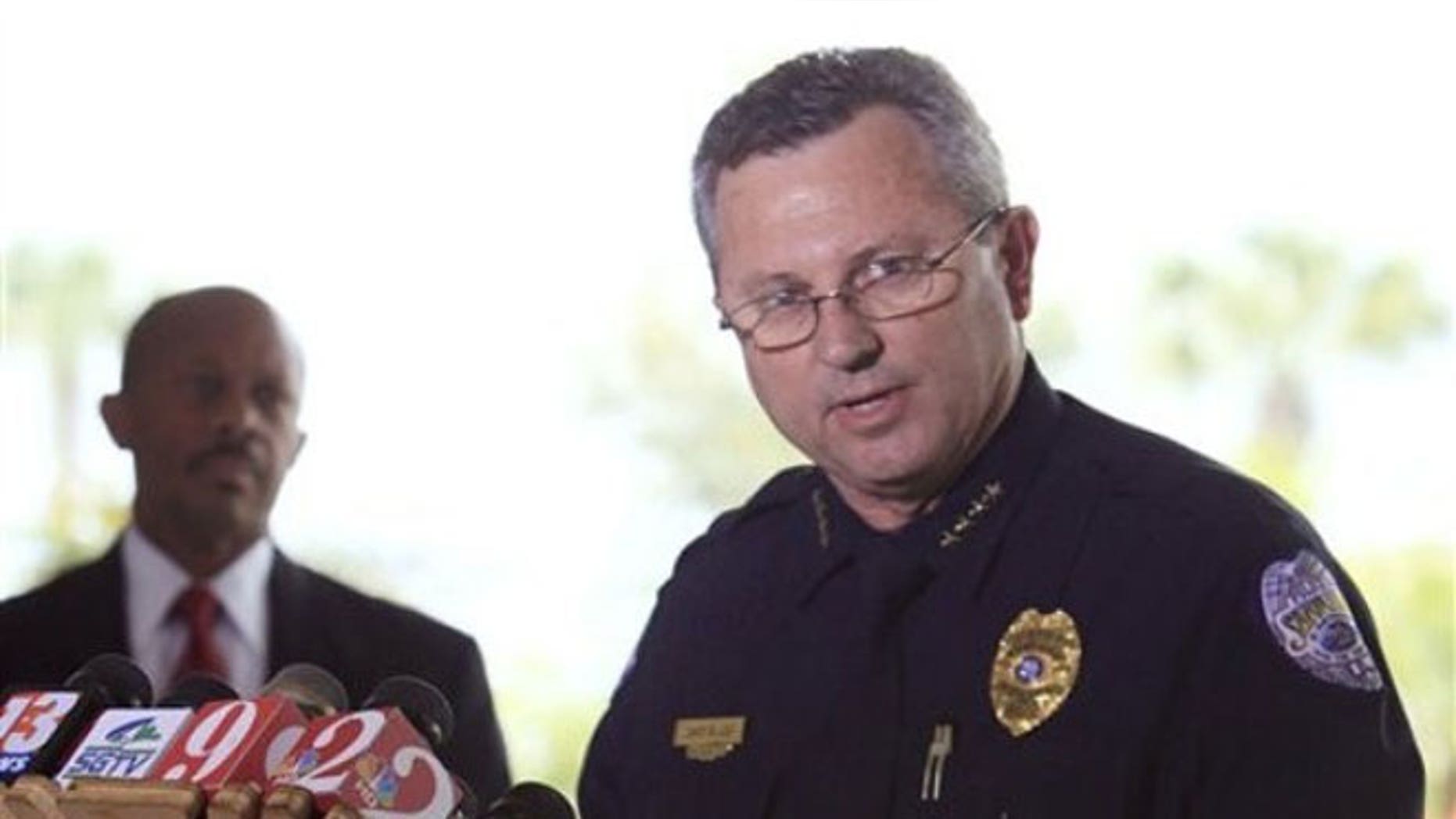 In this March 22, 2012 file photo, Sanford Police Chief Bill Lee speaks to the media during a news conference as city manager Norton Bonaparte Jr. listens at left, in Sanford, Fla.