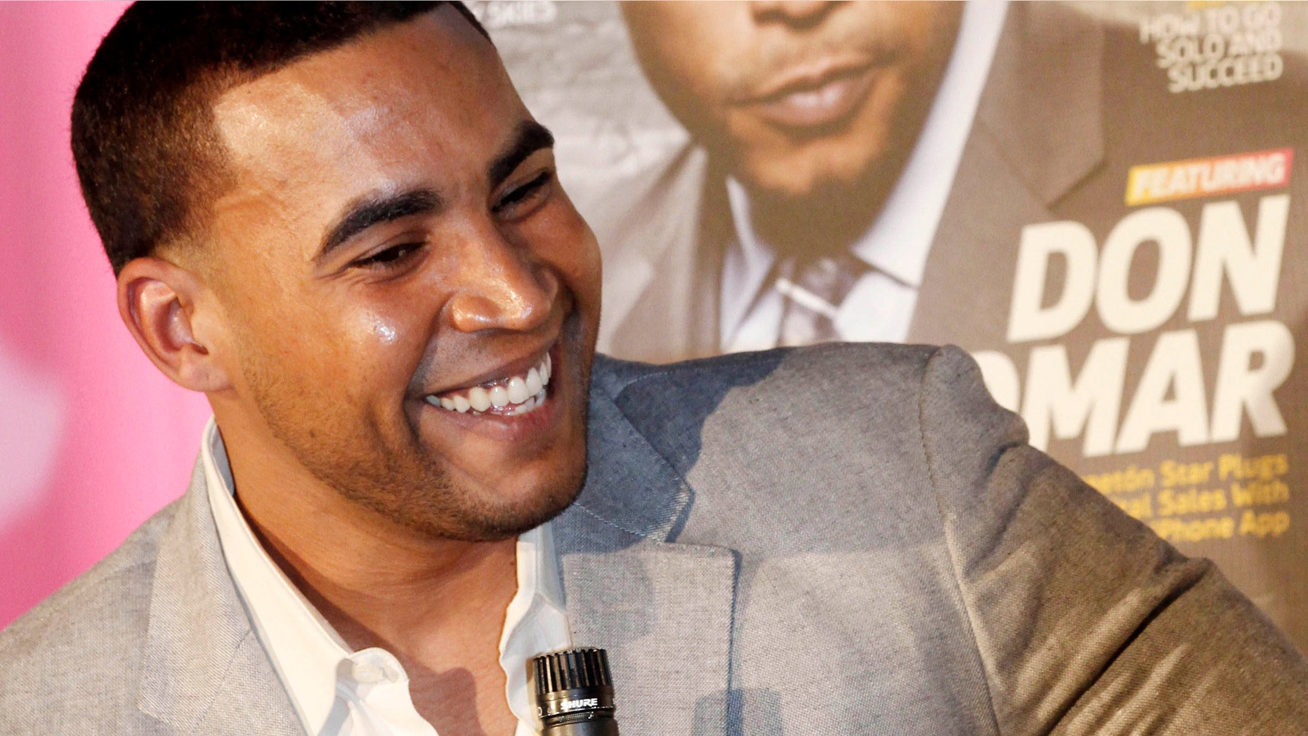 Puerto Rican reggaeton singer-rapper Don Omar smiles as he talks to a reporter in Miami on Tuesday. (AP Photo/Alan Diaz)