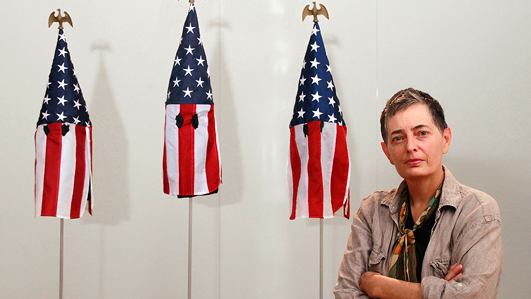 University of Miami professor Billie Lynn sparked outrage for her art exhibit displaying American flags as Ku Klux Klan hoods.