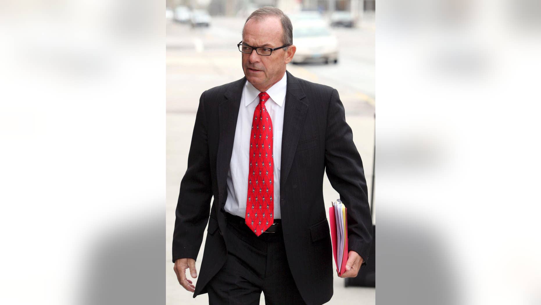 FILE - In this April 29, 2009, file photo, Tim Blixseth arrives at the federal courthouse in Missoula, Mont. The one-time billionaire is due in federal court in Butte, Mont., Thursday, Dec. 18, 2014, to explain why failed to comply with an order to pay $13.8 million to the creditors of an ultra-luxury Montana resort. (AP Photo/Mike Albans, File)