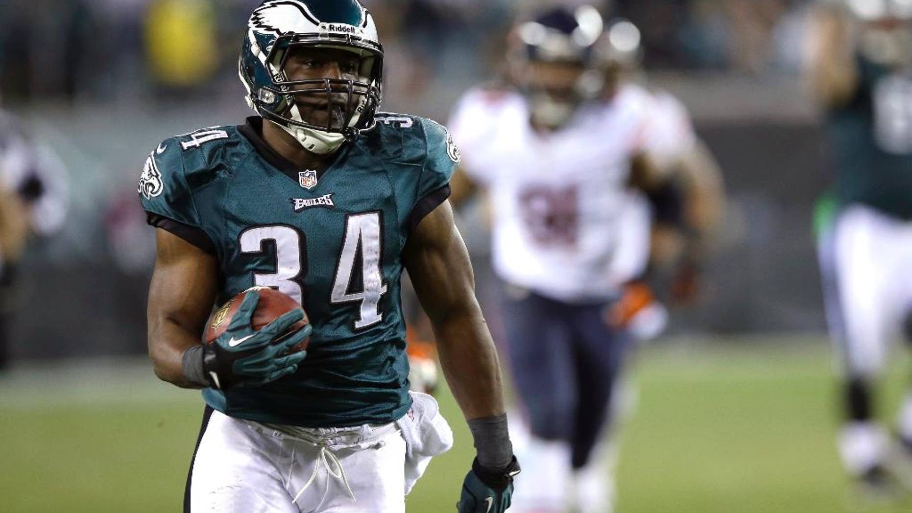 FILE - In this Dec. 22, 2013, file photo, Philadelphia Eagles' Bryce Brown rushes for a touchdown during the second half of an NFL football game against the Chicago Bears in Philadelphia. The Buffalo Bills have acquired Brown in a trade with the Eagles on Saturday, May 10, 2014. In the trade, Buffalo and Philadelphia swapped seventh-round picks in this year's draft. The Bills also gave up a conditional draft pick, either a fourth-rounder next year or a third-round selection in 2016. (AP Photo/Michael Perez, File)