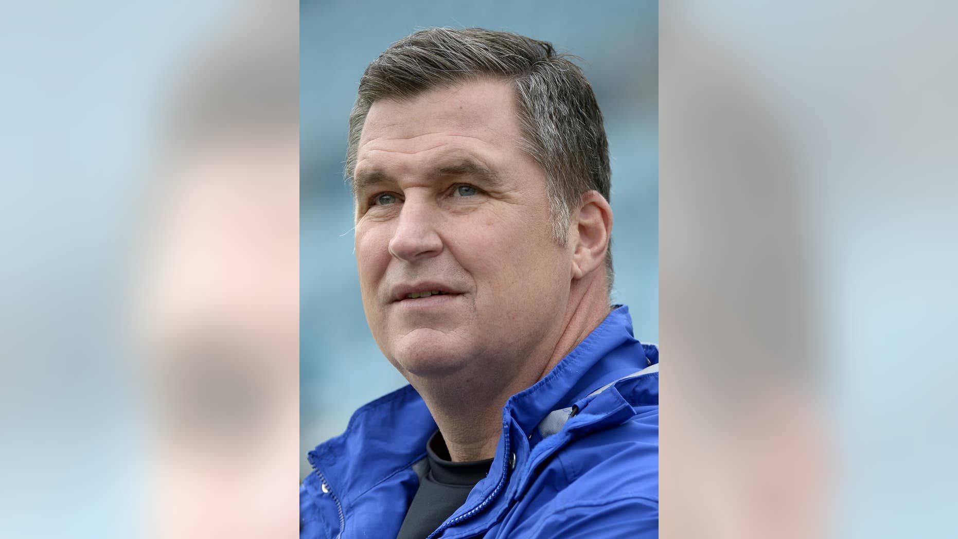 In this Dec. 15, 2013, photo, Buffalo Bills coach Doug Marrone watches players warm up for NFL football game between the Jacksonville Jaguars and the Bills in Jacksonville, Fla. Marrone said Tuesday night, April 22, 2014, he had a cancerous mole removed, and added it will not have any effect on him doing his job. Marrone made the announcement in a statement released through the team. (AP Photo/Phelan M. Ebenhack)