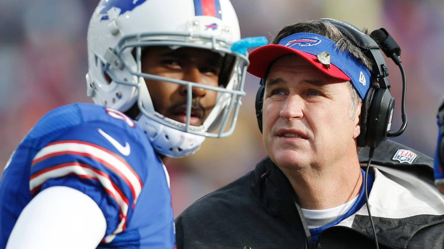FILE - In this Nov. 17, 2013 file photo, Buffalo Bills head coach Doug Marrone, right, and Buffalo Bills quarterback EJ Manuel talk during the first half of an NFL football game against the New York Jets, in Orchard Park, N.Y. Leaving the Bills defense to new coordinator Jim Schwartz, Marrone is making the retooled EJ Manuel-led offense his primary focus during the team's spring minicamp sessions.(AP Photo/Gary Wiepert, File)