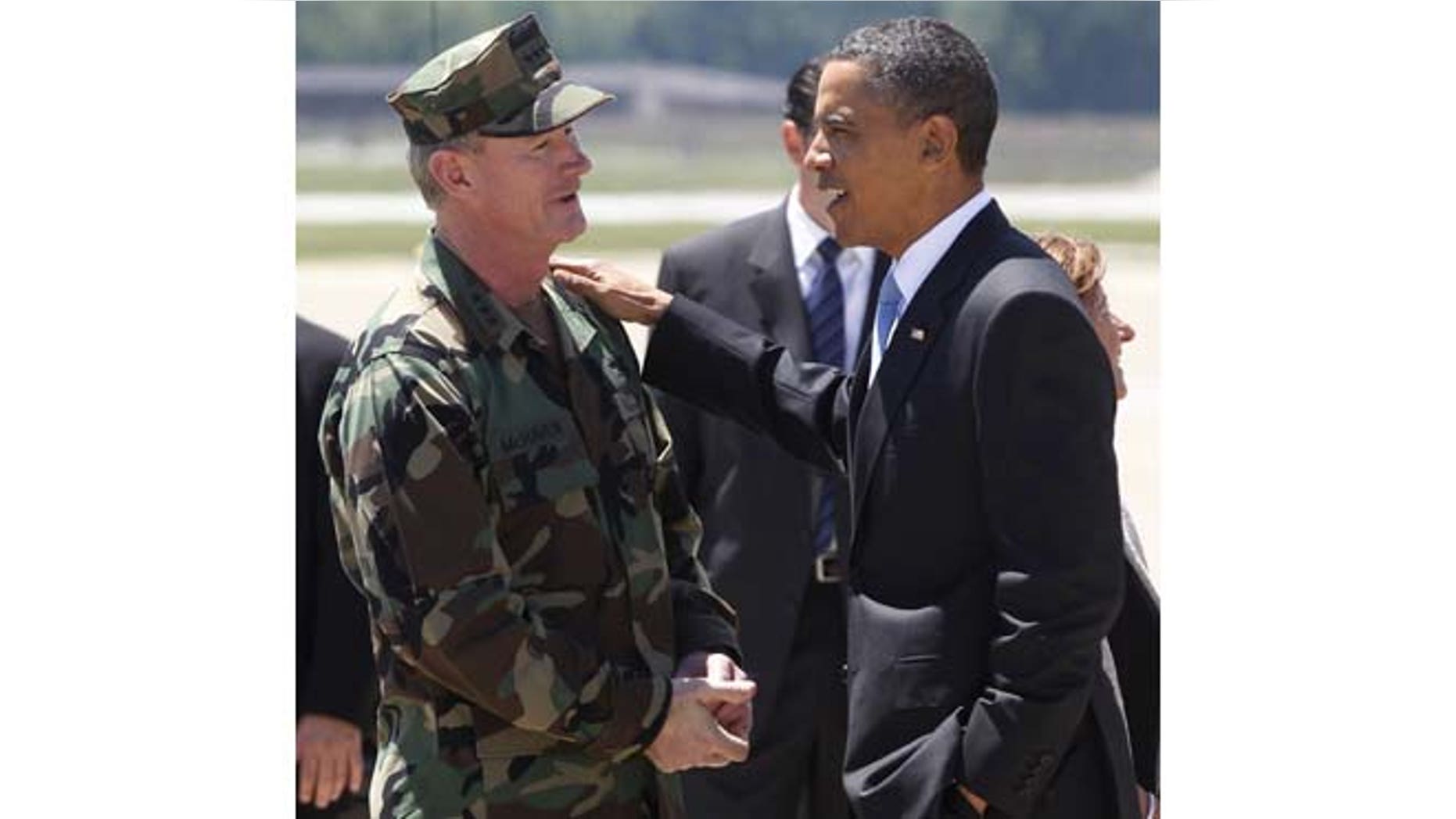 FILE - In this May 6, 2011, file photo President Barack Obama talks with U.S. Navy Vice Admiral William H. McRaven, commander of Joint Special Operations Command (JSOC), at Campbell Army Airfield in Fort Campbell, Ky., just days after McRaven led operational control of Navy SEAL Team Six's successful mission to get Osama bin Laden. McRaven ordered military files about the raid on bin Laden's hideout to be purged from Defense Department computers and sent to the CIA, where they could be more easily shielded from ever being made public.