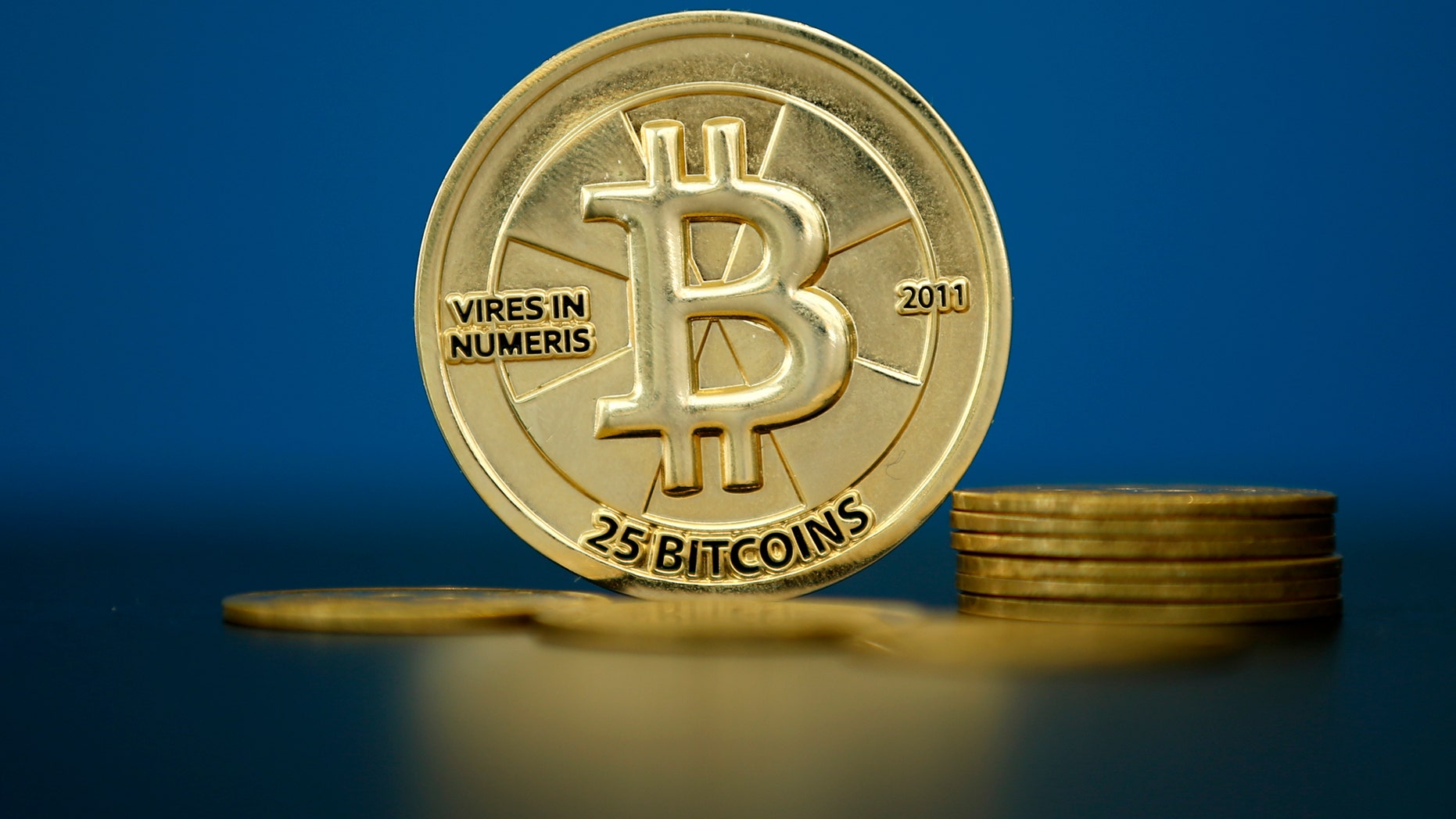 Bitcoin coins (virtual currency) are seen in an illustration image taken at La Maison du Bitcoin in Paris, France, May 27, 2015.