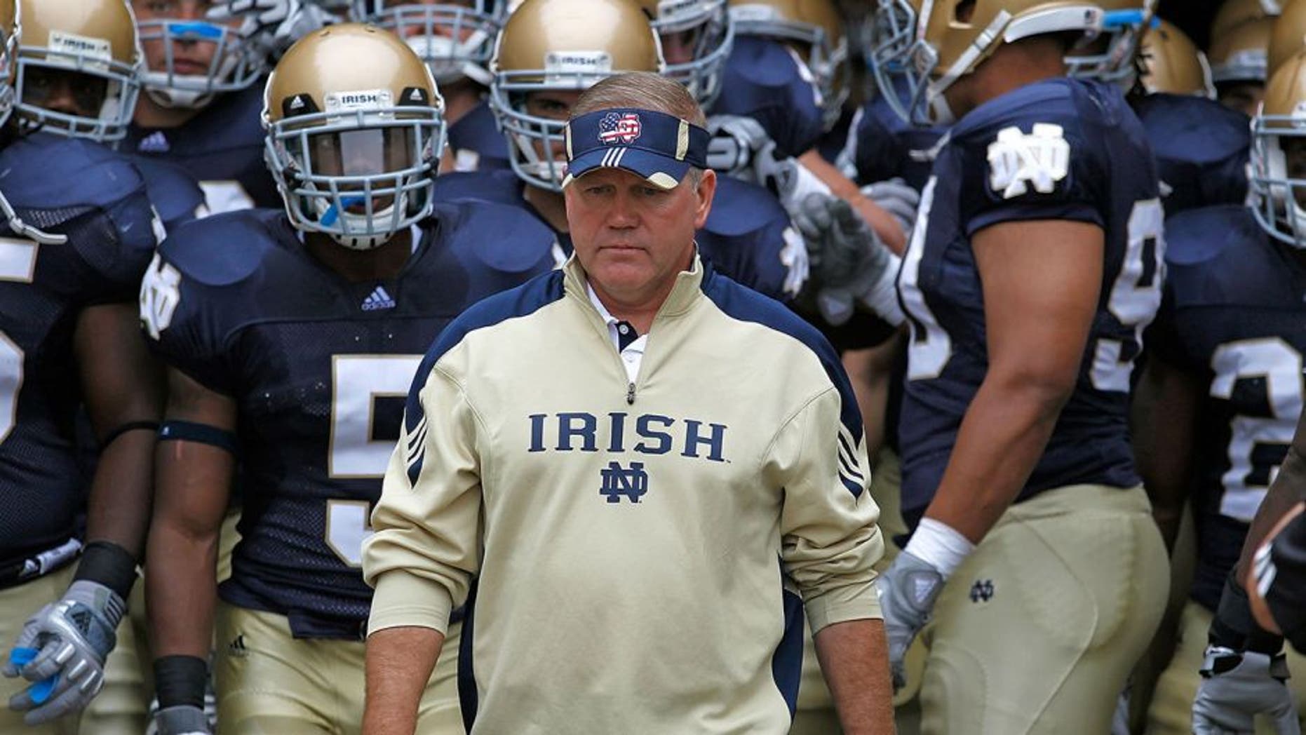 SOUTH BEND, IN - SEPTEMBER 11: Head coach Brian Kelly of the Notre Dame Fighting Irish waits to enter the field with his team before a game against the Michigan Wolverines at Notre Dame Stadium on September 11, 2010 in South Bend, Indiana. Michigan defeated Notre Dame 28-24. (Photo by Jonathan Daniel/Getty Images) *** Local Caption *** Brian Kelly