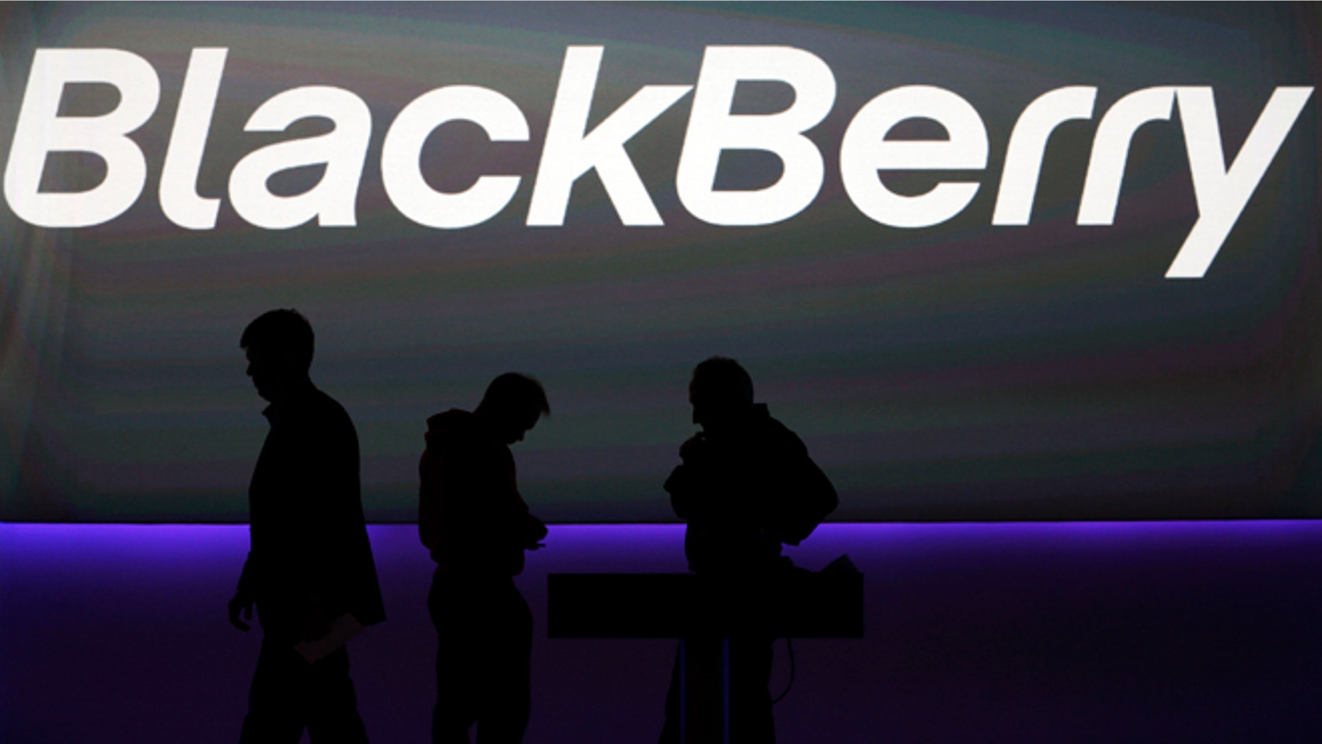 FILE - In this Wednesday, Jan. 30, 2013, file photo, blackBerry's employees prepare the launch event for the company's new smartphones in London. Fairfax Financial Holdings has offered to buy BlackBerry in a deal that values the Canadian smartphone company at about US$4.7 billion, on Monday, Sept. 23, 2013. AP Photo/Lefteris Pitarakis, File)