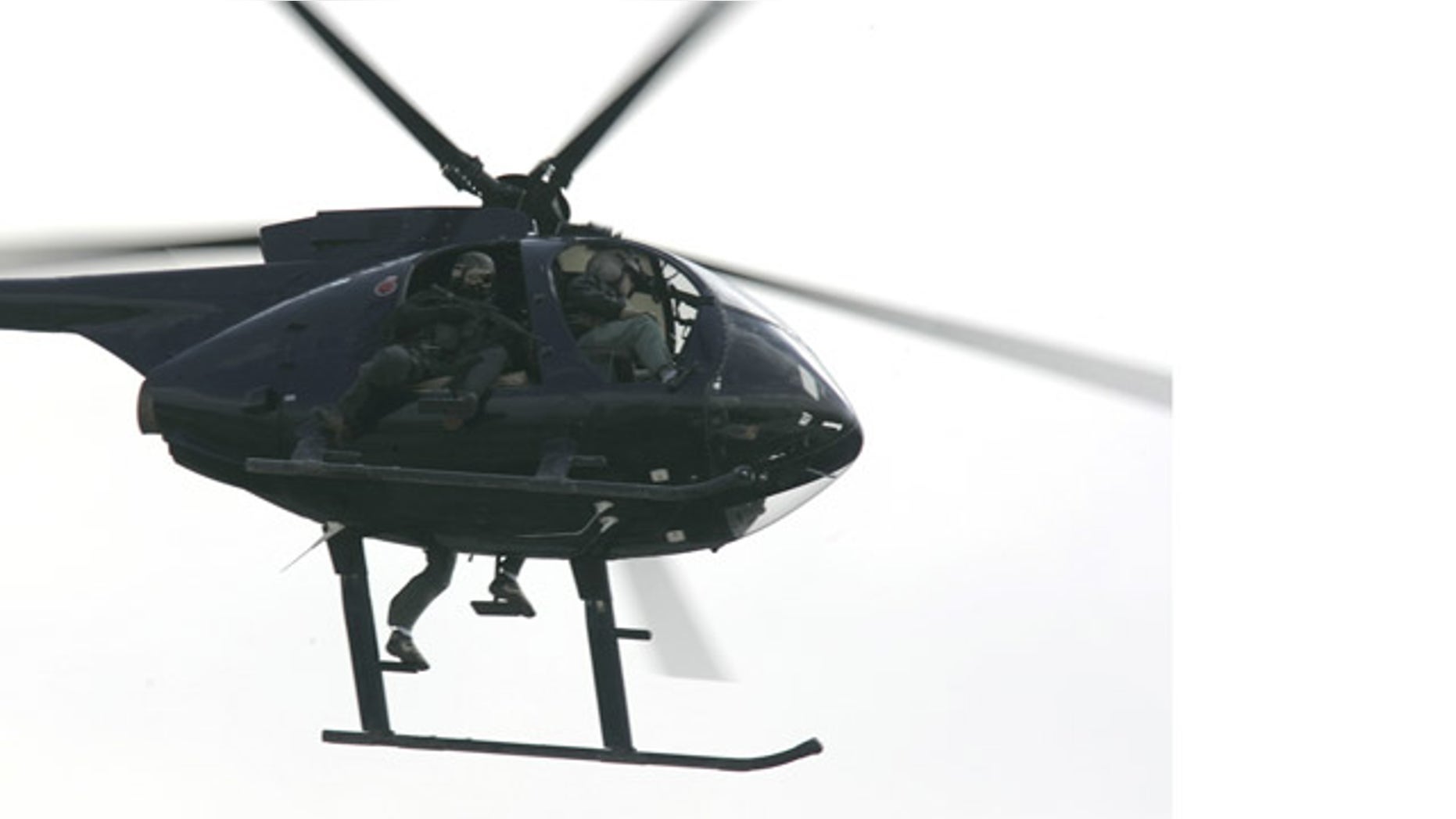 FILE 2007: Blackwater USA helicopter flies over central Baghdad.