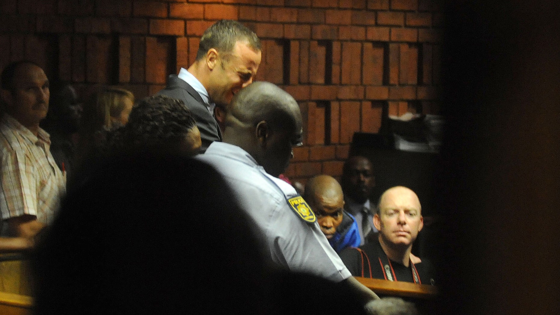 Feb. 15, 2013: South African athlete Oscar Pistorius reacts, in court in Pretoria, South Africa at his bail hearing in the murder case of his girlfriend Reeva Steenkamp.
