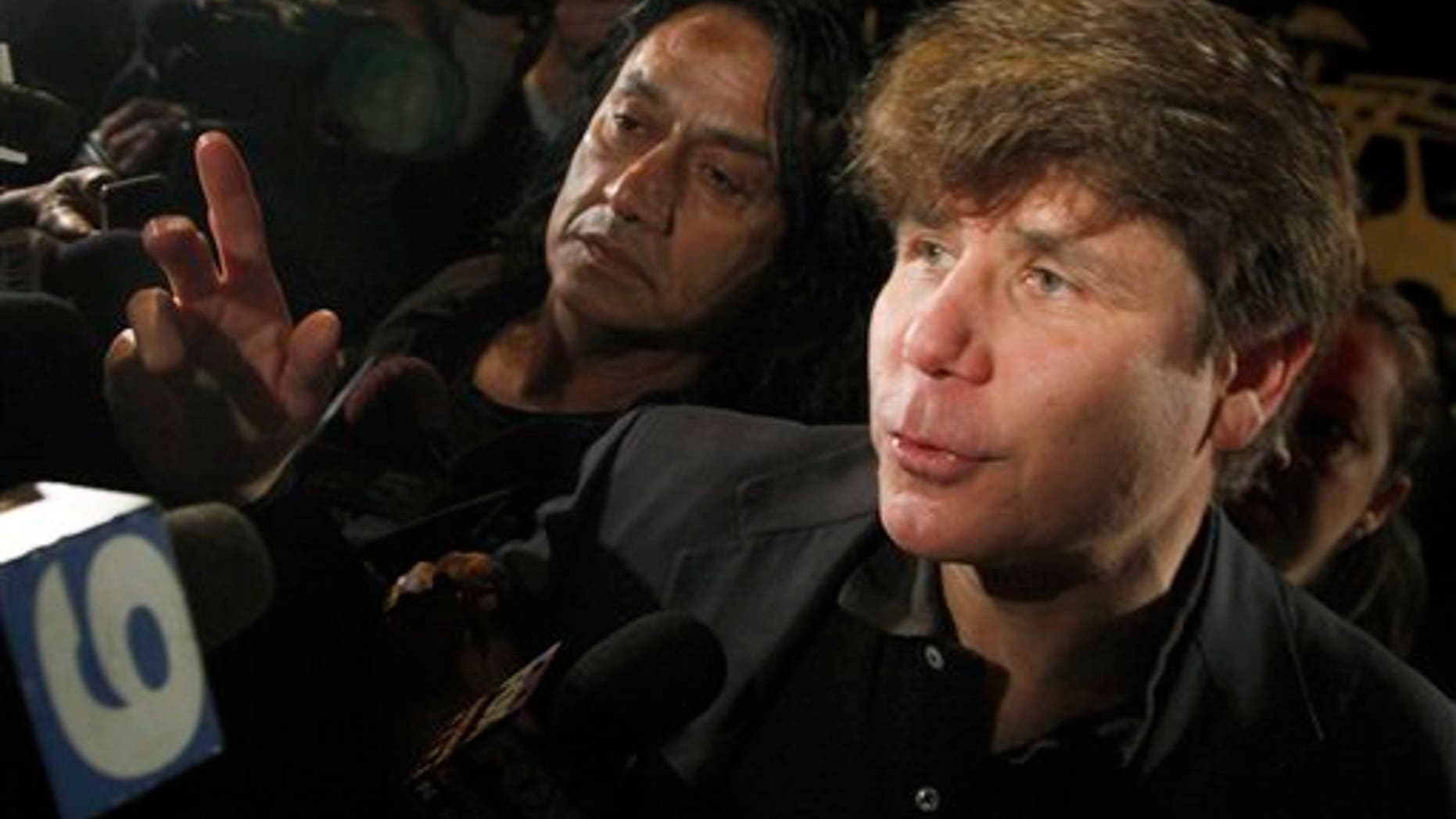 March 15, 2012: FILE - In this file photo, former Illinois Gov. Rod Blagojevich departs his Chicago home for Littleton, Colo., to begin his 14-year prison sentence on corruption charges.