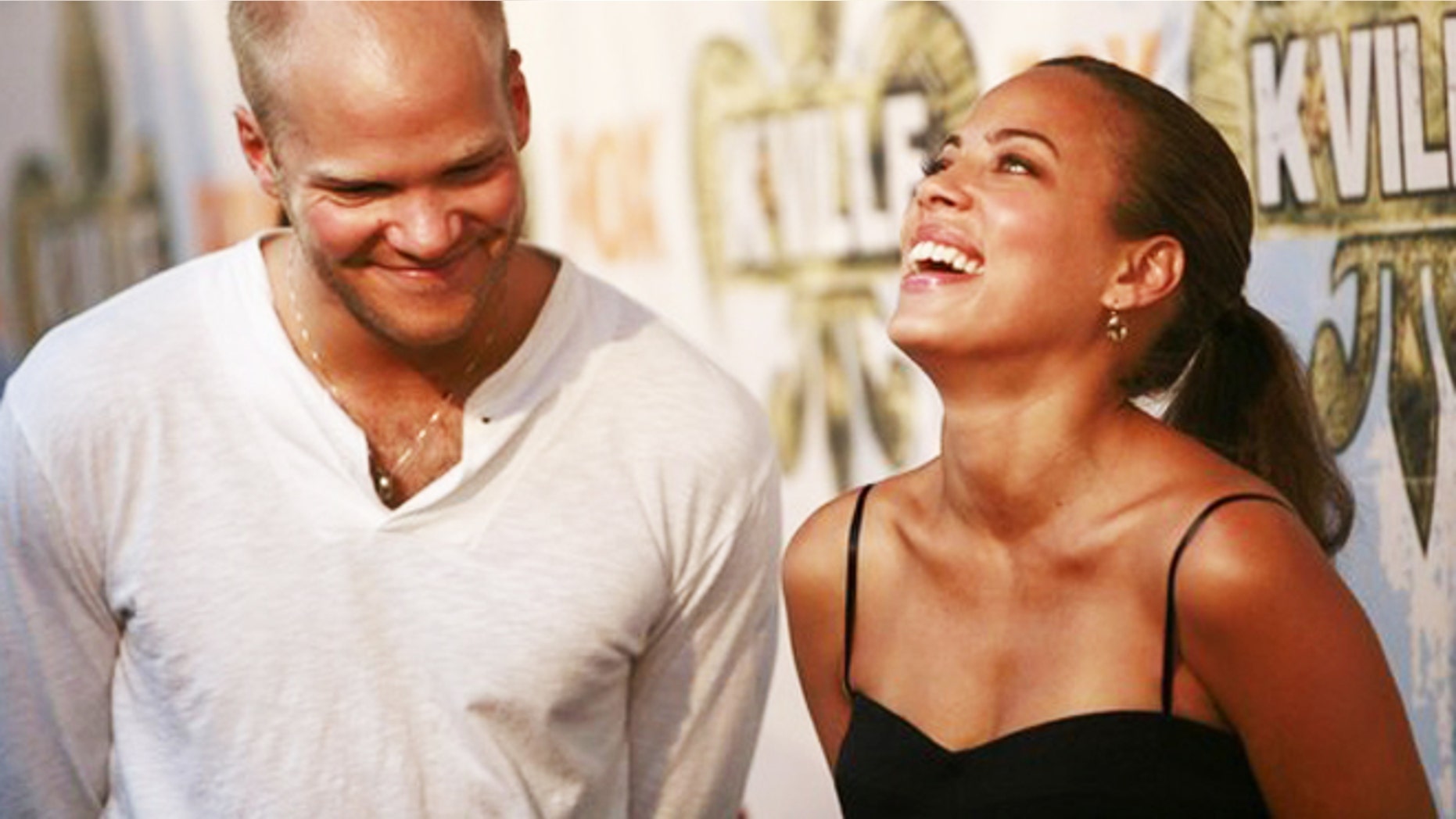 Cast members Blake Shields (L) and Tawny Cypress laugh before a party celebrating the television series "K-Ville" in New Orleans, Lousiana August 19, 2007.