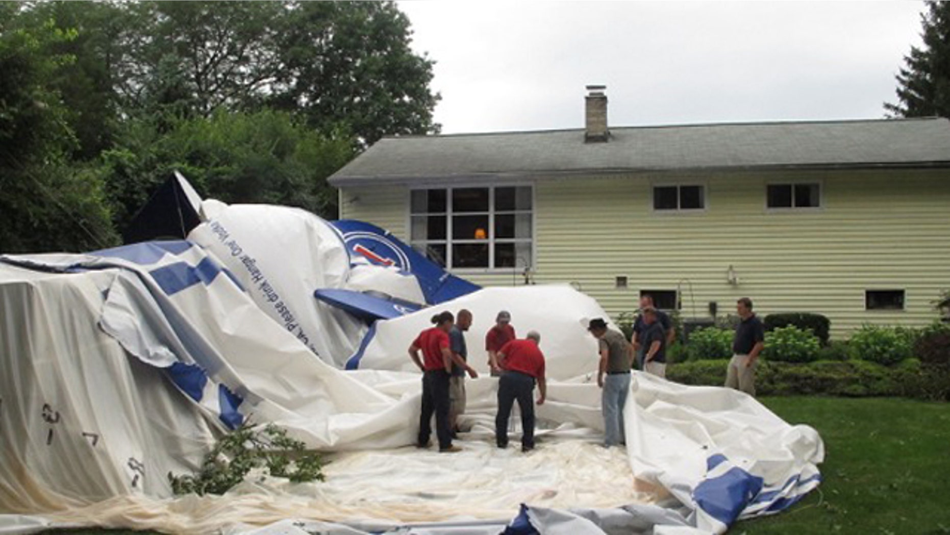 Aug. 14: Crews take apart a blimp that broke free and landed in a backyard.