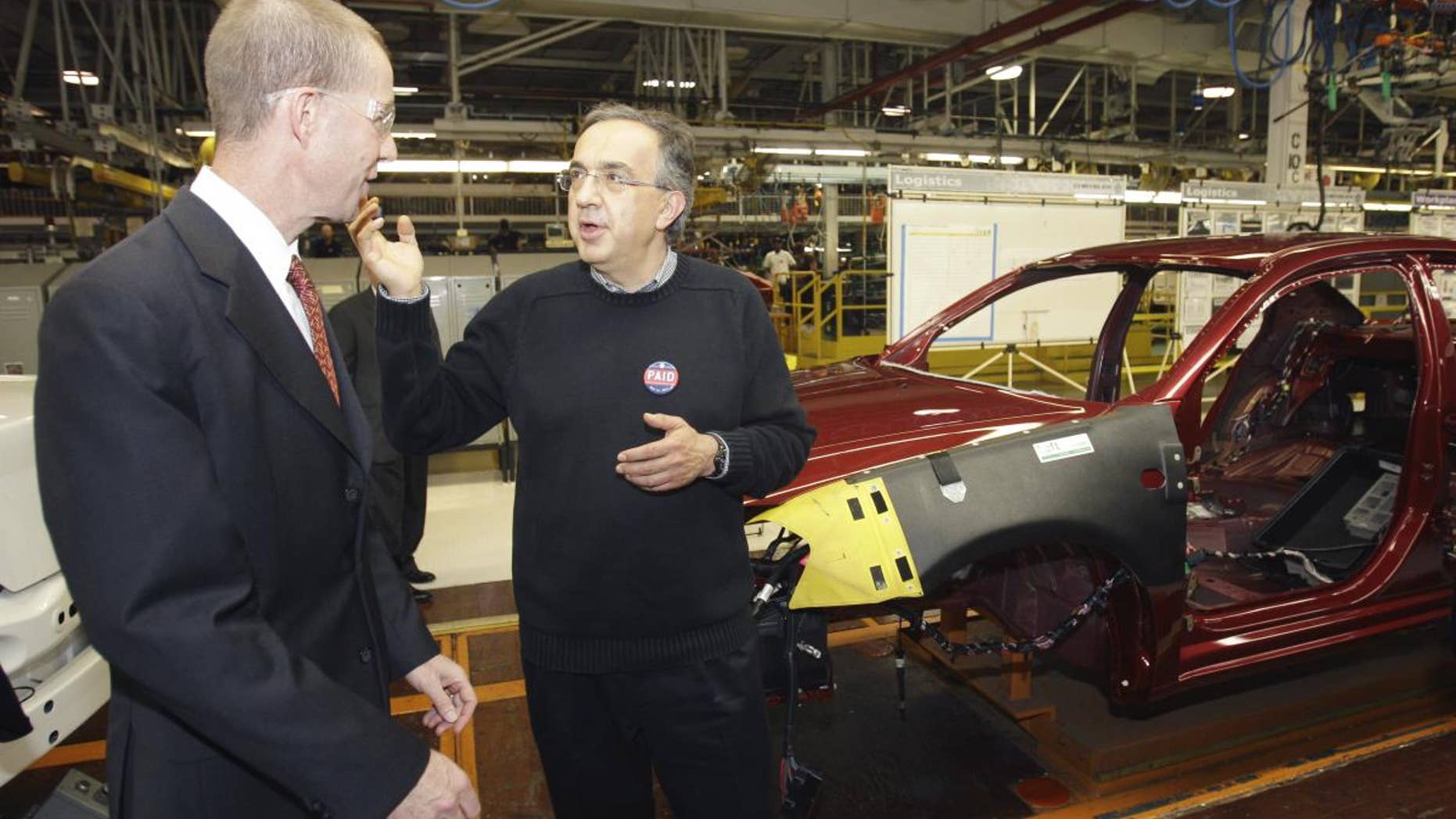 Chrysler Group CEO Sergio Marchionne, right, and Ron Bloom, assistant to President Obama for Manufacturing Policy walk on the assembly line at the Sterling Heights Assembly Plant in Sterling Heights, Mich., Tuesday, May 24, 2011. Marchionne acknowledged and expressed gratitude for the financial support from the U.S. and Canadian governments. (AP Photo/Carlos Osorio)