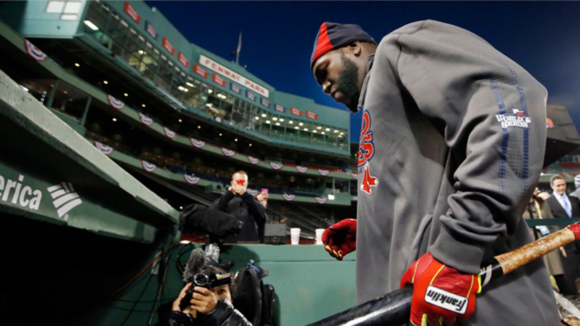 Boston Red Sox designated hitter David Ortiz walks into the dugout after a workout at Fenway Park in Boston, Tuesday, Oct. 29, 2013. The Red Sox are scheduled to host the St. Louis Cardinals in Game 6 of baseball's World Series on Wednesday. (AP Photo/Elise Amendola)