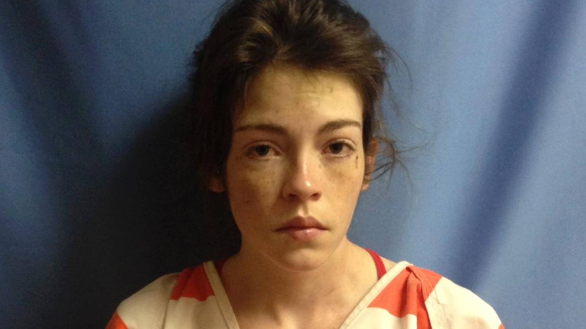 In this police booking photo provided by the Yell County Sheriff's Department in Danville, Ark., Brooke Sueann Floyd poses for a photo, Wednesday, Aug. 30, 2014. Floyd, whose husband and son were found dead in the Ouachita Mountains, has been charged with felony manslaughter. (AP Photo/Yell County Sheriffs Department)