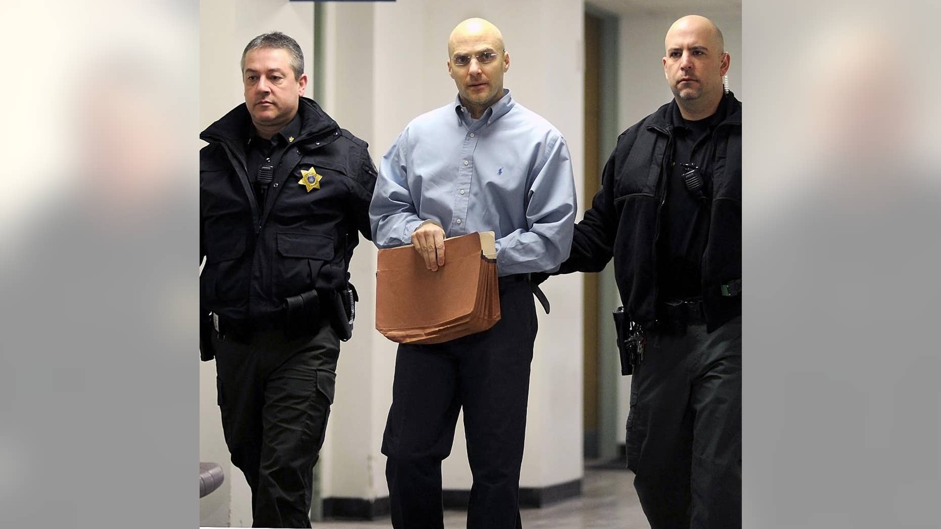 Hugo Selenski is led into the Luzerne County Courthouse, Wilkes-Barre, Pa., Wednesday, Feb. 18, 2015, for the second day of the penalty phase in his double murder trial. A jury on Wednesday spared the life of Selenski, convicted of strangling pharmacist Michael Kerkowski and his girlfriend, Tammy Fassett, during a robbery at the pharmacist's home in 2002 and burying their bodies in his yard, granting a defense request to show mercy despite the brutal nature of the crimes. He will serve life without parole.(AP Photo/The Citizens' Voice, Mark Moran) MANDATORY CREDIT: THE CITIZENS' VOICE, MARK MORAN