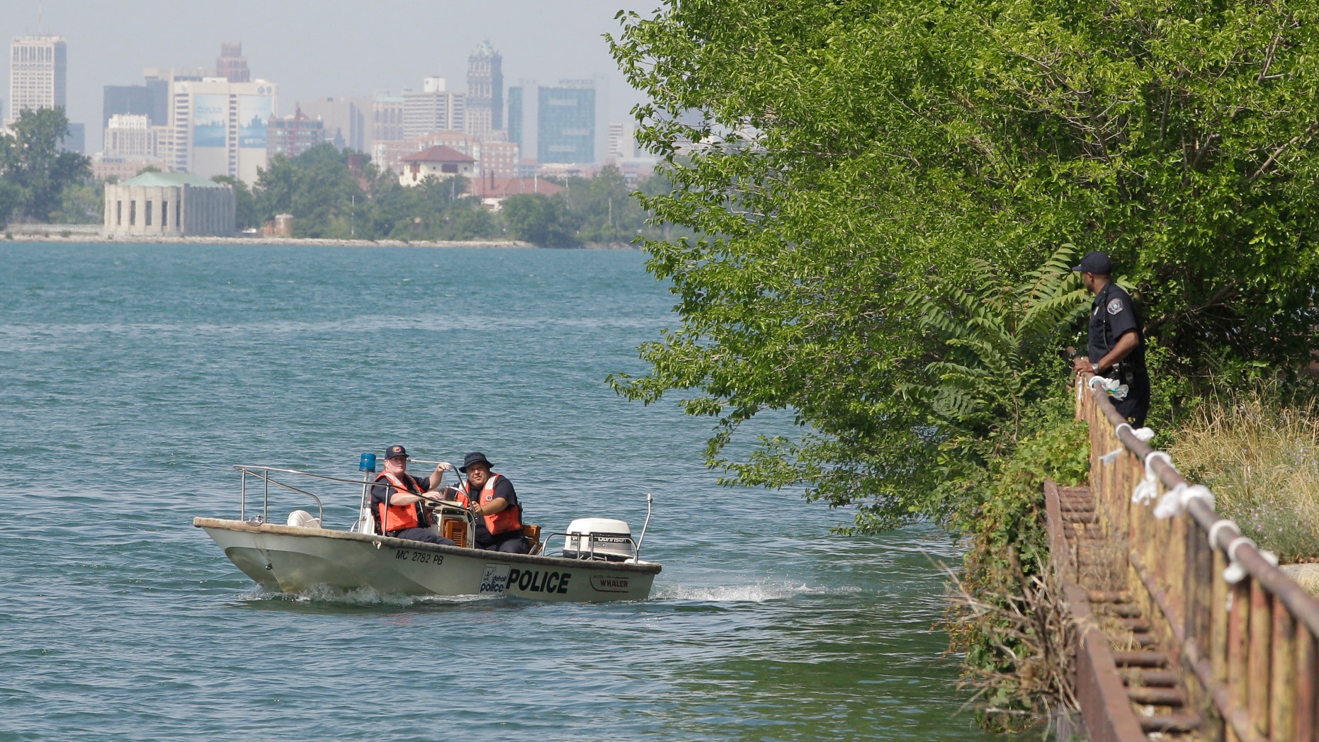July 17, 2012: Detroit police look over the scene in the Detroit River where the U.S. Coast Guard says the bodies of a man and a woman whose heads, hands and feet were cut off were found floating.