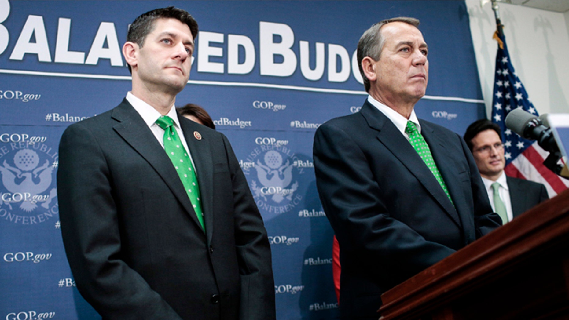WASHINGTON, DC - MARCH 19: Rep. Paul Ryan (R-WI) (L) and House Speaker John Boehner (R-OH) listen to a question as House Republican leaders address the media after a party conference on March 19, 2013 in Washington, DC. GOP leaders asked that the president work with them to create a balanced budget plan, citing President Clinton's efforts to work with House Republicans on a budget in the 1990s. (Photo by T.J. Kirkpatrick/Getty Images)