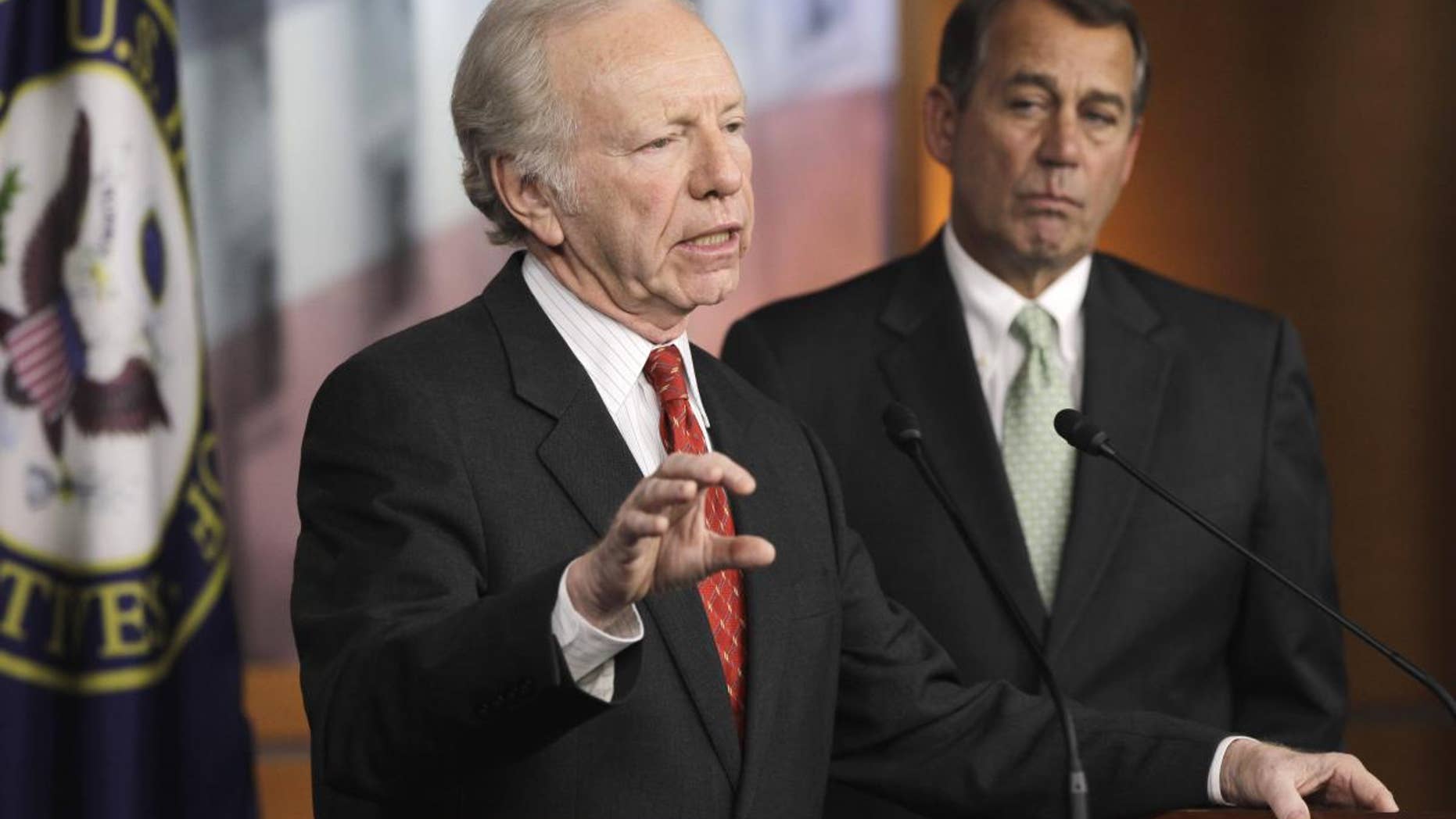 Sen. Joseph Lieberman, I-Conn., left, accompanied by House Speaker John Boehner of Ohio, gestures during a news conference on Capitol Hill in Washington, Wednesday, Jan. 26, 2011, to discuss the introduction of legislation on the DC Opportunity Scholarship Program. (AP Photo/Charles Dharapak)