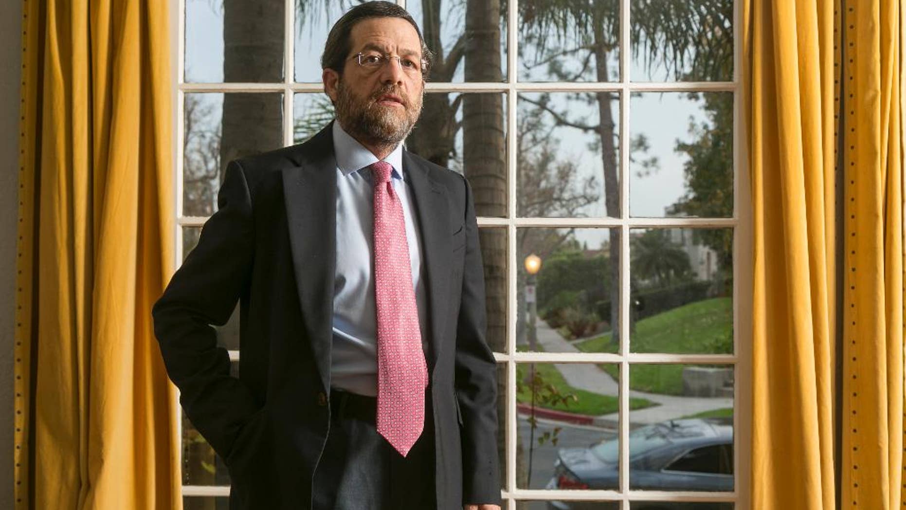 FILE - In this Dec. 15, 2014 file photo, U.S. businessman businessman Jacob Ostreicher poses for a photo in Los Angeles. A Bolivian judge sentenced to three years in prison on Thursday, Jan. 15, 2015 the No. 2 figure in the extortion ring that victimized Ostreicher and was exposed by actor Sean Penn. Ostreicher went to Bolivia to salvage a rice-farming venture only to be arrested in June 2011 and held 18 months without charge in a money-laundering investigation. The extortion ring drained the assets of the $25 million rice venture. (AP Photo/Damian Dovarganes, File)