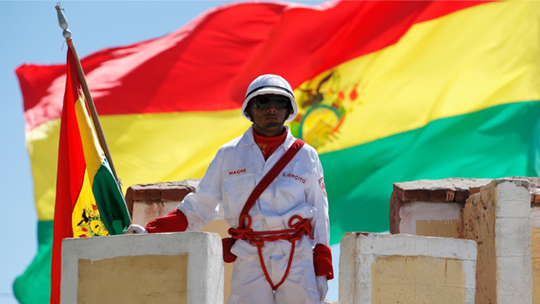 UYUNI, BOLIVIA - JANUARY 11: A soldier at Denodado y Aguerrido RI-4 LOA Military Base stands at attention during Day 7 of the 2014 Dakar Rally on January 11, 2014 in Uyuni, Bolivia. (Photo by Dean Mouhtaropoulos/Getty Images)