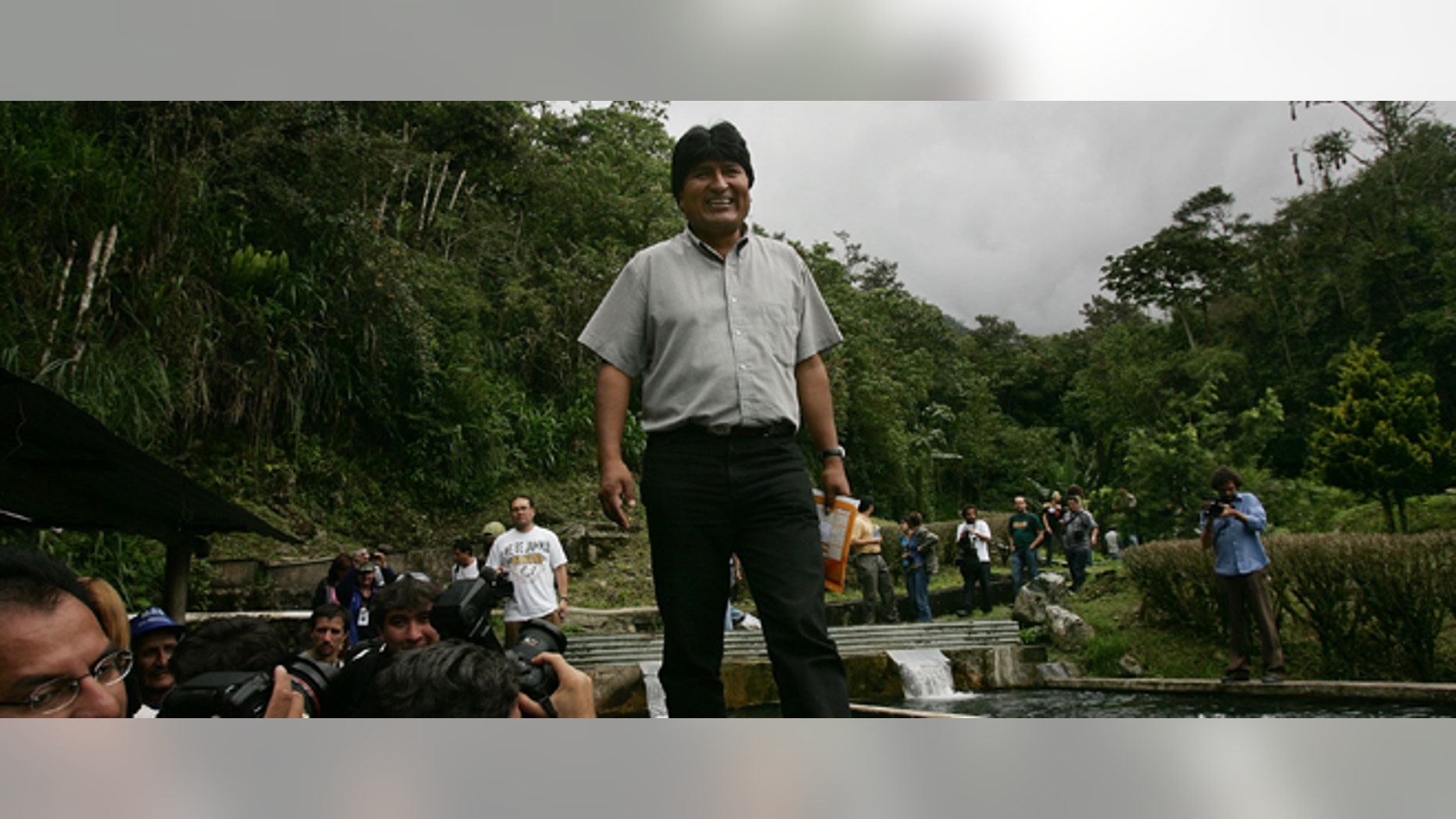 INCACHACA, BOLIVIA - DECEMBER 17: Bolivian Presidential Candidate Evo Morales walks beside a trout pond while on his way to Chapare December 17, 2005 in Incachaca, Bolivia. Bolivia, one of South America's poorest countries, is about to face a crucial election with leftist candidate Evo Morales leading the field. Morales, a one time coca farmer and union leader, is leading in the polls for the presidential election on December 18. Washington is paying close attention to the race as fears grow of yet another leftist government. (Photo by Spencer Platt/Getty Images)