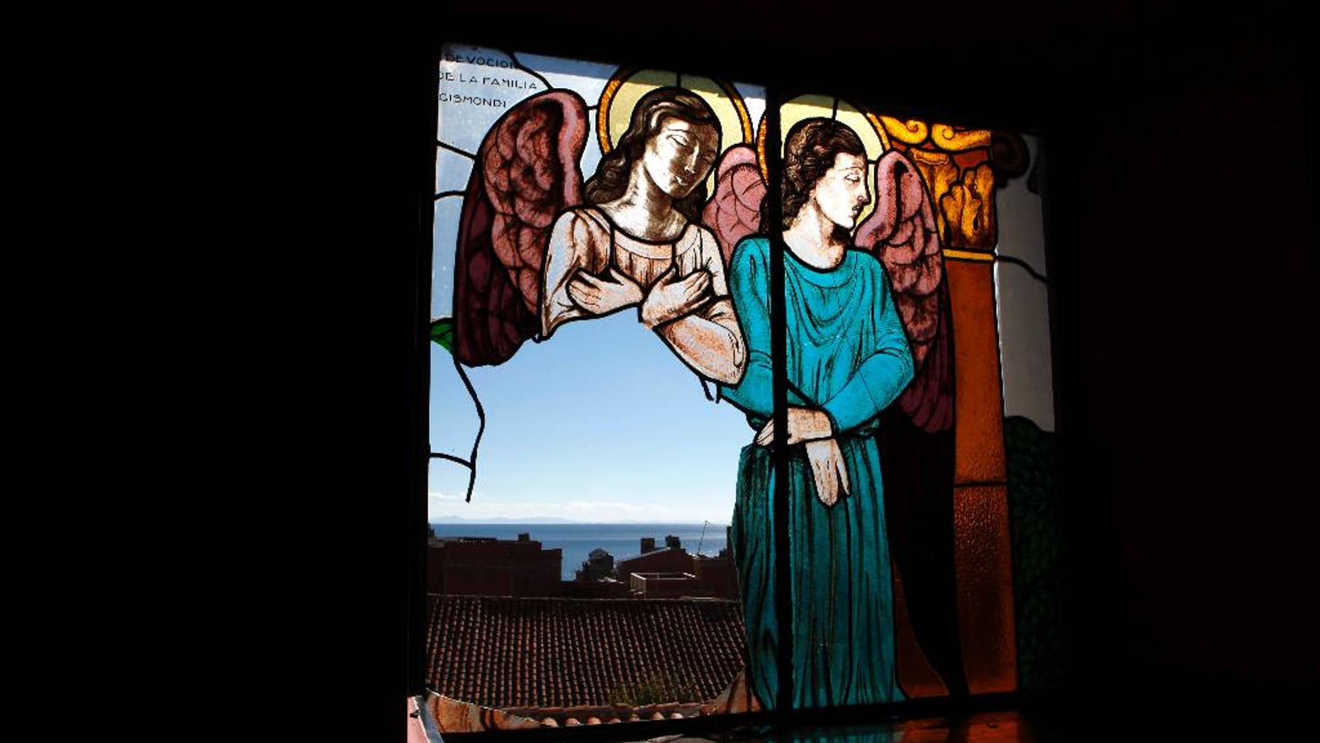 April 23, 2013: In this file photo, a stained glass window, broken by thieves according to the local priest, remains damaged at the Basilica of Our Lady of Copacabana in Copacabana, Bolivia. (AP)