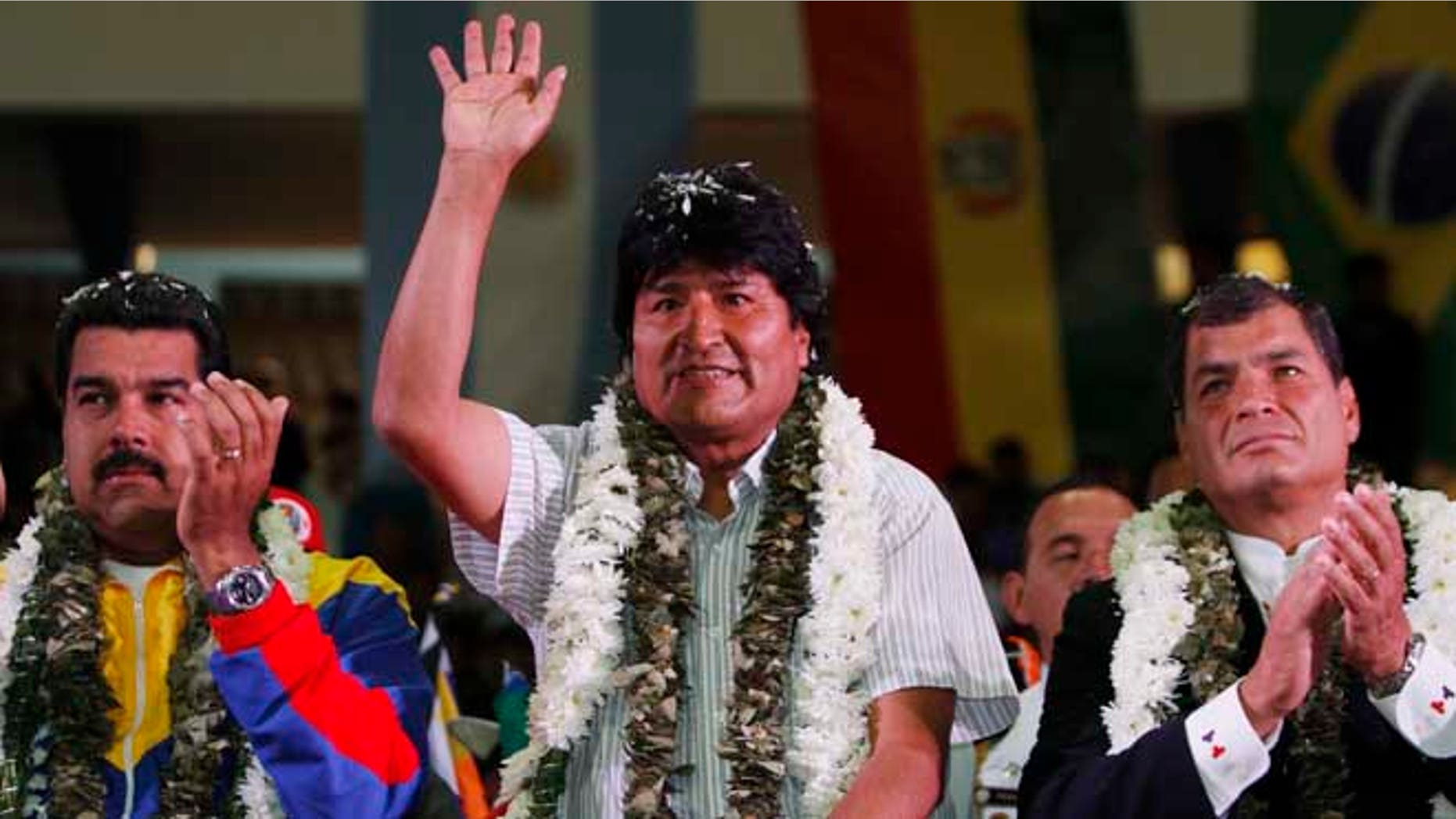 July 4, 2013: Venezuela's President Nicolas Maduro, left, Ecuador's President Rafael Correa, right, and Bolivia's President Evo Morales acknowledge supporters during a welcome ceremony for presidents attending an extraordinary meeting in Cochabamba, Bolivia.
