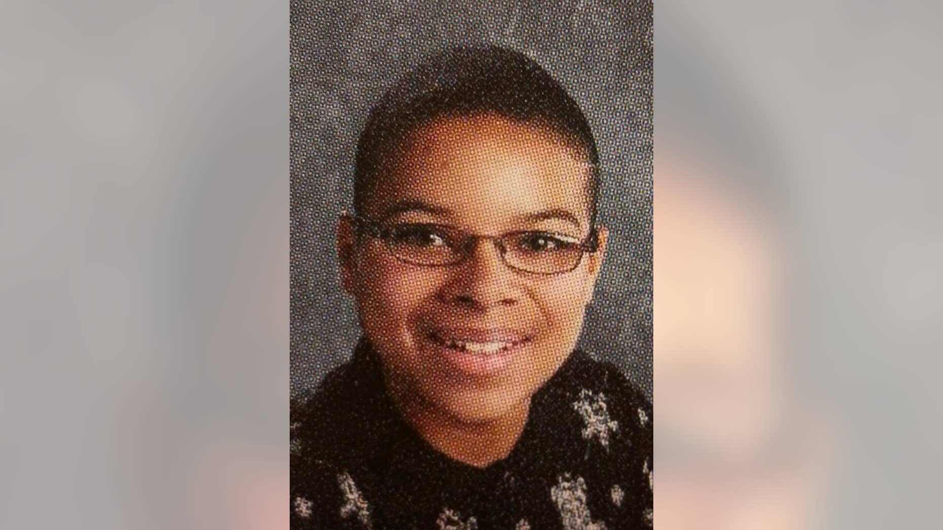 This 2010 yearbook photo provided by Topeka Public Schools from a Topeka West High School shows John Booker. Booker, accused of planning a suicide attack at Fort Riley, was arrested Friday, April 10, 2015, while trying to arm what he thought was a bomb near the Kansas military base as part of a plot to support the Islamic State group, federal prosecutors said. (AP Photo/Topeka Public Schools)