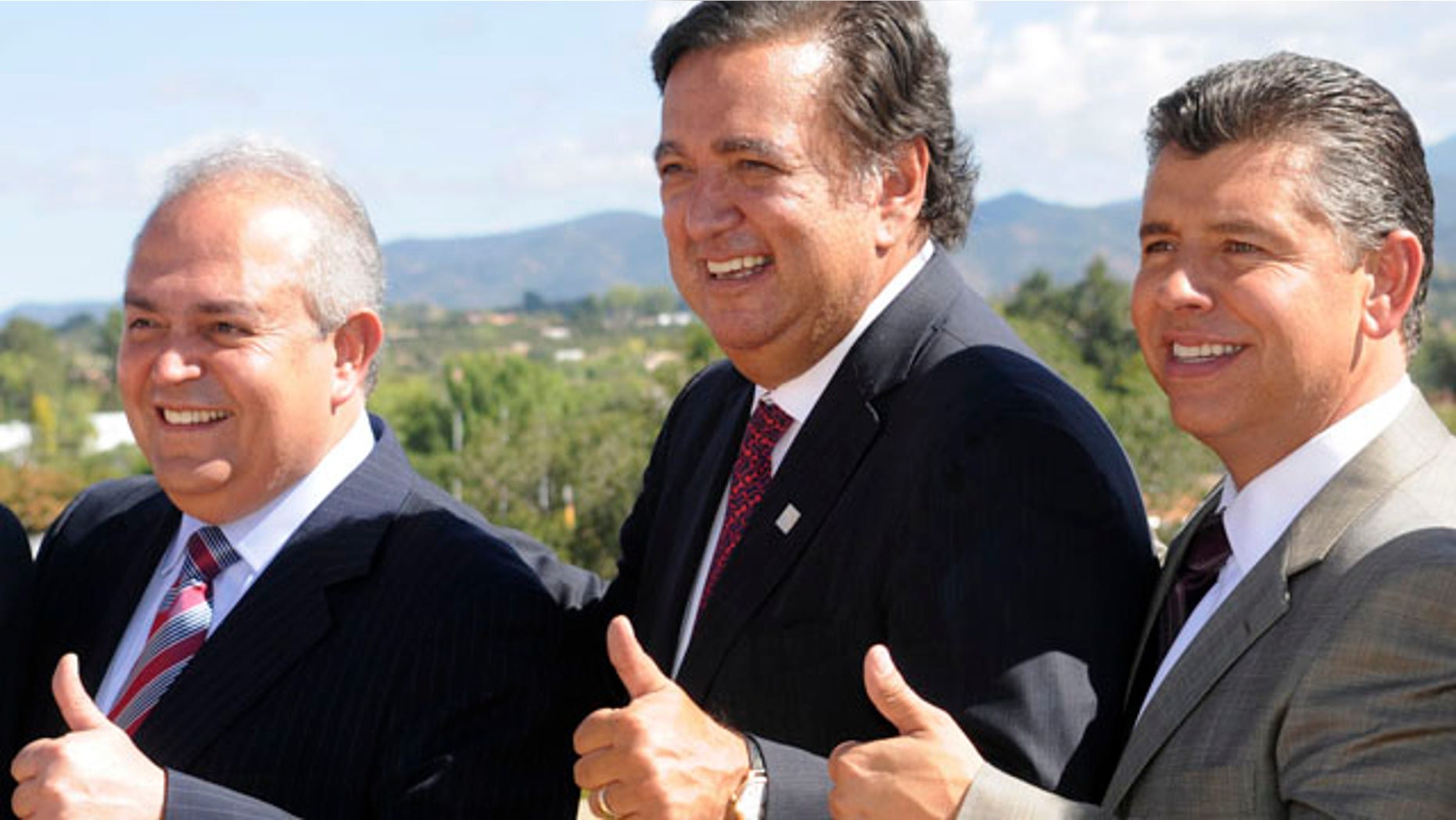 Baja California Governor Jose Guadalupe Osuna Millan, left, New Mexico Governor Bill Richardson, center, and Lt. Governor of California Abel Maldonado pose for photos at the 2010 Border Governors Conference in Santa Fe, New Mexico on Monday Sept. 20, 2010. (AP Photo/Dean Hanson, Pool)