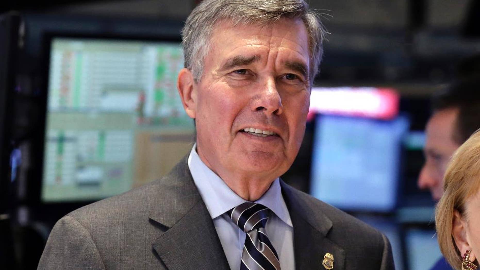 FILE - U.S. Customs and Border Protection Commissioner R. Gil Kerlikowske poses for photos after ringing the New York Stock Exchange closing bell, Tuesday, Aug. 5, 2014 file photo. Kerlikowske scheduled a news conference Thursday Sept. 18, 2014 in Washington to discuss what his office said were “developments toward CBP’s commitment to increase transparency and accountability.” (AP Photo/Richard Drew, File)