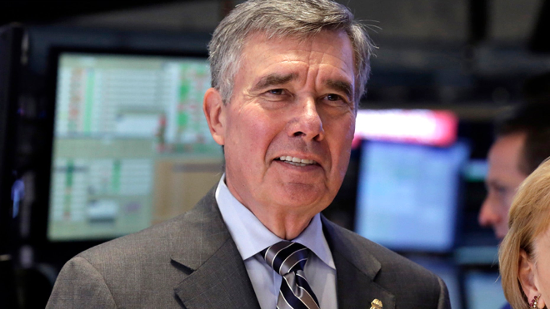 FILE - U.S. Customs and Border Protection Commissioner R. Gil Kerlikowske poses for photos after ringing the New York Stock Exchange closing bell, Tuesday, Aug. 5, 2014 file photo. Kerlikowske scheduled a news conference Thursday Sept. 18, 2014 in Washington to discuss what his office said were âdevelopments toward CBPâs commitment to increase transparency and accountability.â (AP Photo/Richard Drew, File)
