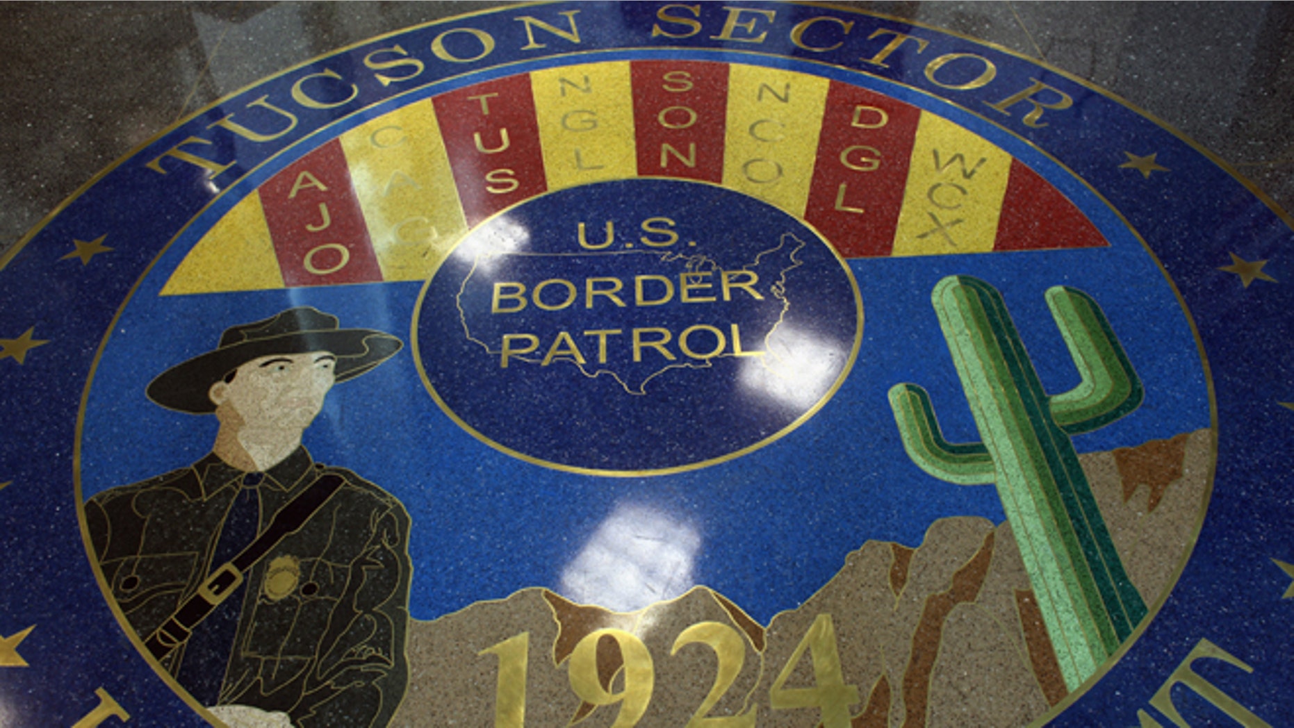 TUCSON, AZ - DECEMBER 07: A mosaic adorns the floor of the U.S. Border Patrol headquarters on December 7, 2010 in Tucson, Arizona. The Tucson sector of the U.S.- Mexico border is considered the most heavily trafficked by illegal immigrants and drug smugglers in the United States. (Photo by John Moore/Getty Images)