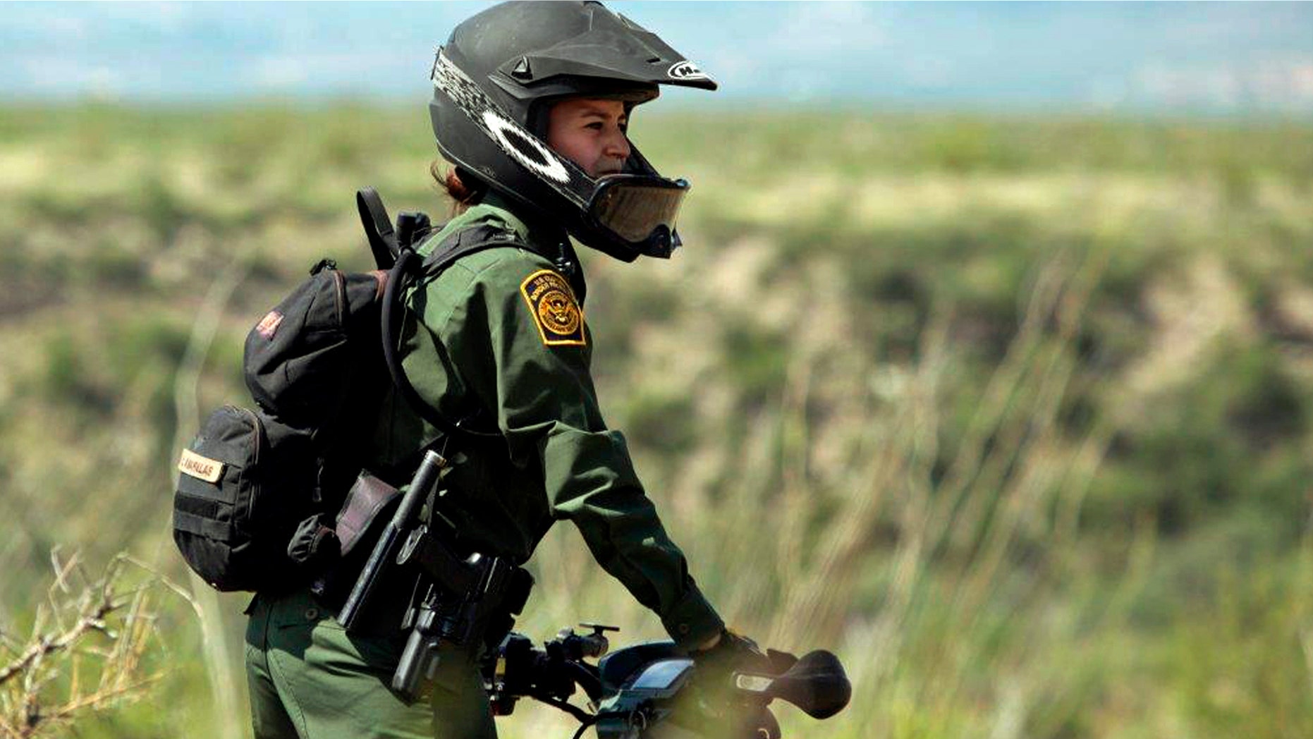 Crystal A. Diaz, a U.S. Border Patrol agent with the Tucson Sector in Arizona, rides her ATV while on patrol.