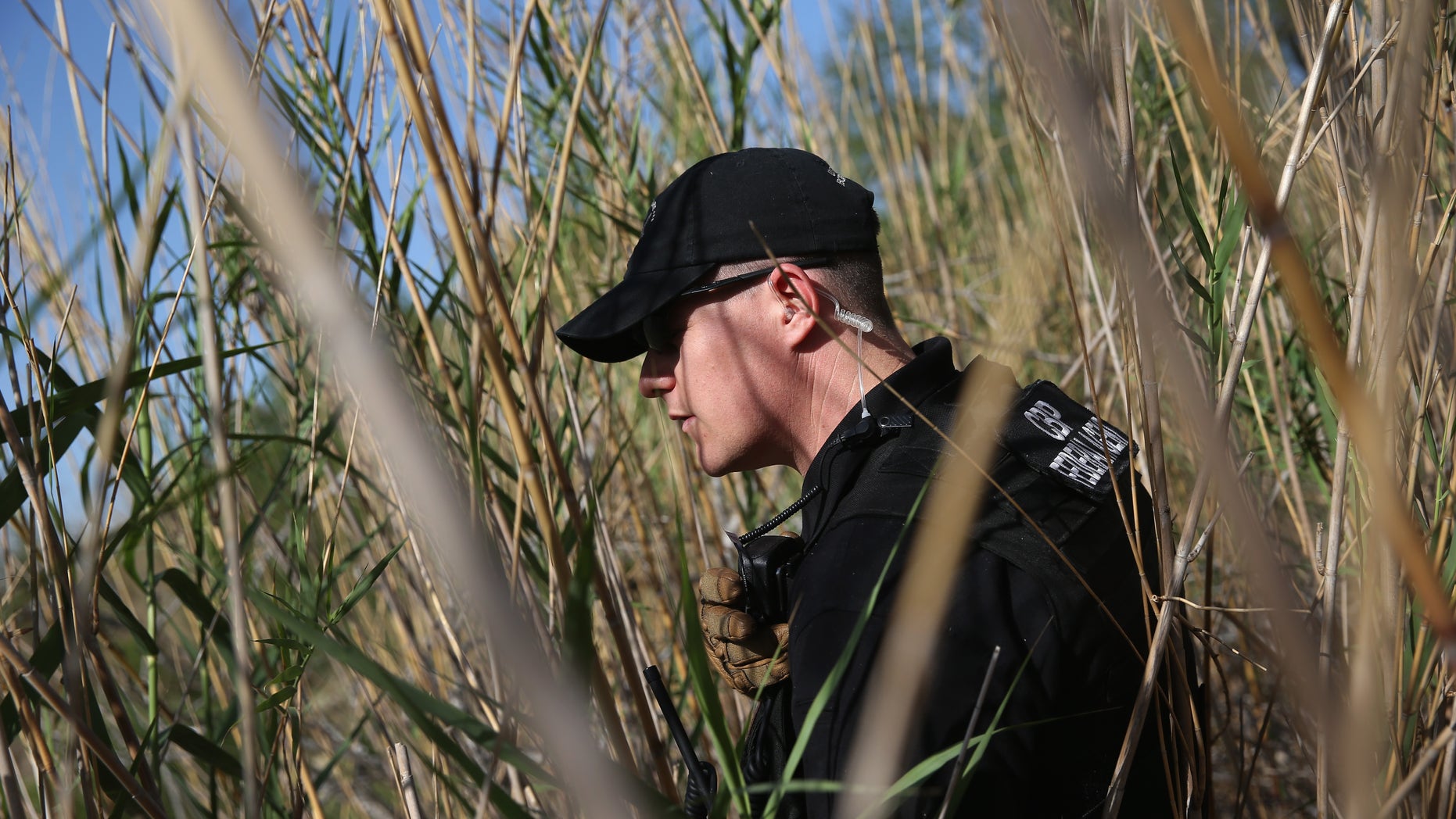 MISSION, TX - APRIL 11: U.S. Office of Air and Marine pilot Jake Dreher searches for suspected drug smugglers while on a ground mission along the Rio Grande River on April 11, 2013 in Mission, Texas. A smuggling mission was broken up by U.S. Border Patrol agents with helicopter support from the Office of Air and Marine. In addition to heavy drug smuggling in the area, Border Patrol agents say they have also seen an additional surge in immigrant traffic in Texas' Rio Grande Valley sector since immigration reform negotiations began this year in Washington D.C. (Photo by John Moore/Getty Images)